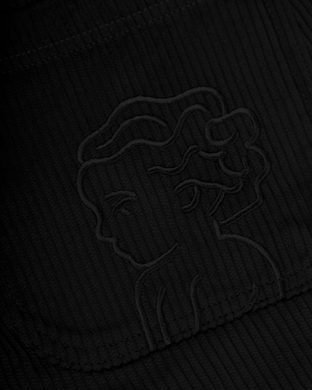The Big Ikon Corduroy Relaxed Fit Pants in black offer a blend of comfort and style. Made from 100% cotton, these pants provide a soft and breathable feel. The relaxed fit ensures all-day comfort, while the Big Ikon embroidered logo on the back pocket adds a unique touch. With two front and two back pockets, they offer practicality for everyday wear.