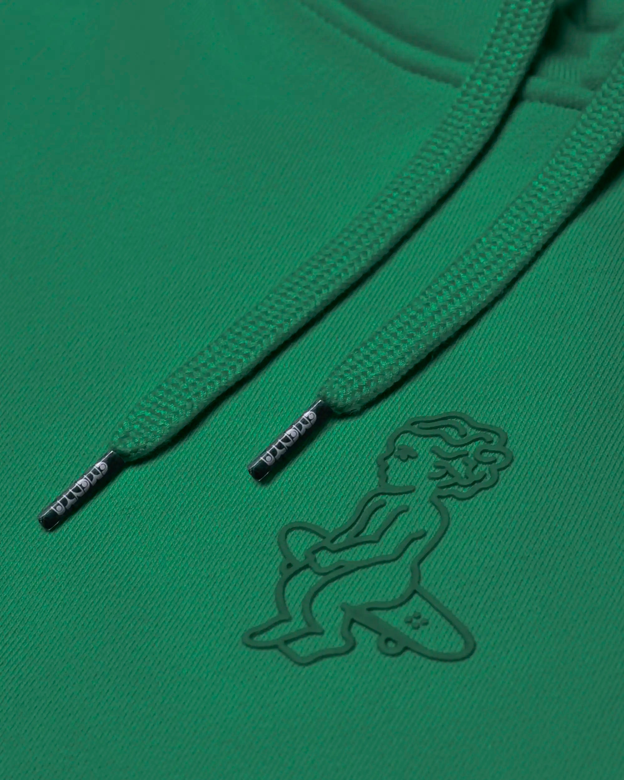 100% cotton (480 gsm) with brushed fleece interior
Evergreen color with an embossed textured Ikon stamp on the back
Subtle signature embroidery on the right wrist
Ribbed cuffs and hem for secure, comfortable fit
Classic kangaroo pocket for easy storage
Zip-less design with a clean pullover silhouette
Made in Portugal
Unisex fit