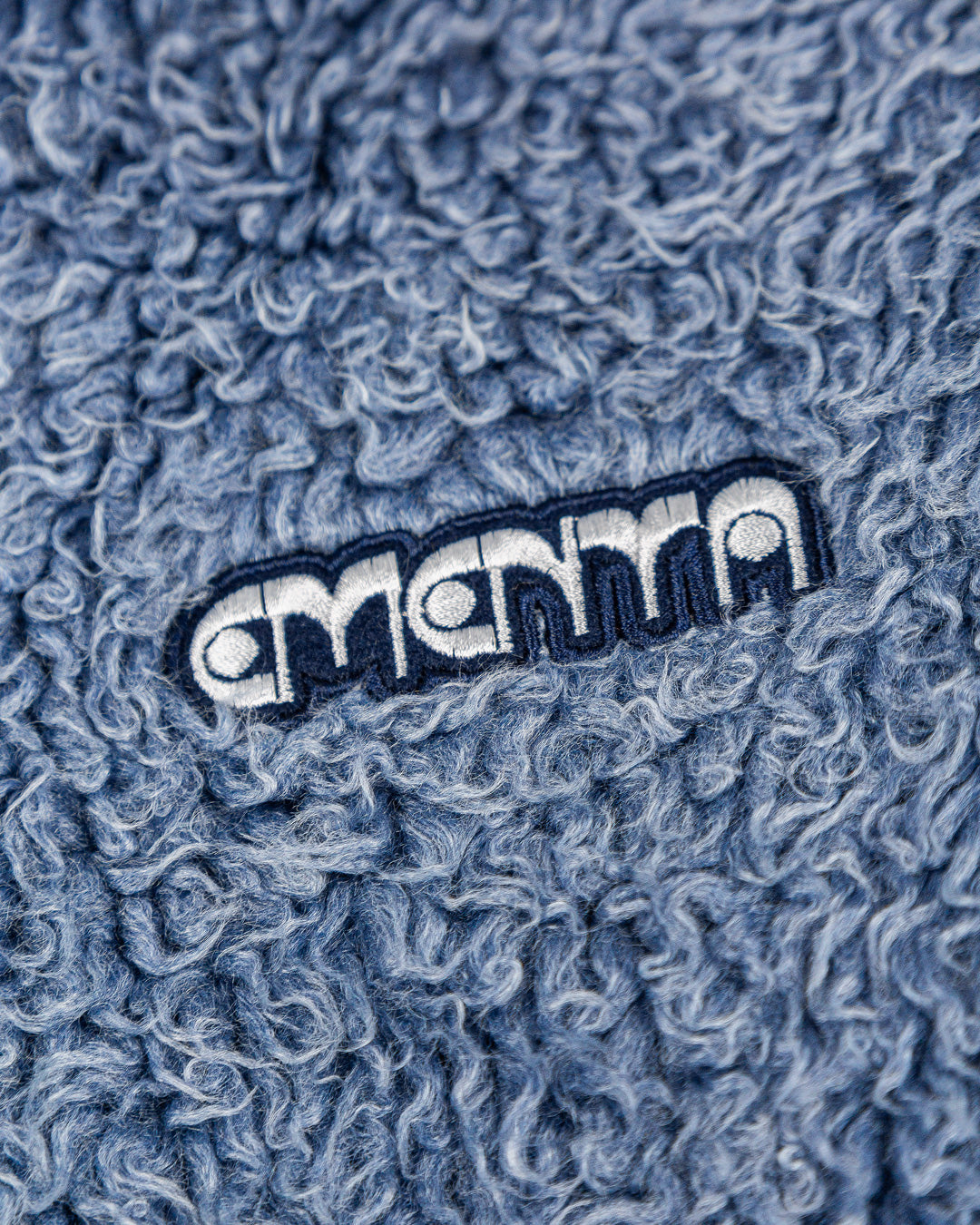 The Poncha Jacket is designed for warmth and comfort with its soft blue fur exterior. Inside, it features diamond stitching for added texture and durability.
It offers adjustable wrists and hips for a customizable fit, along with two exterior pockets and an interior pocket for convenient storage.