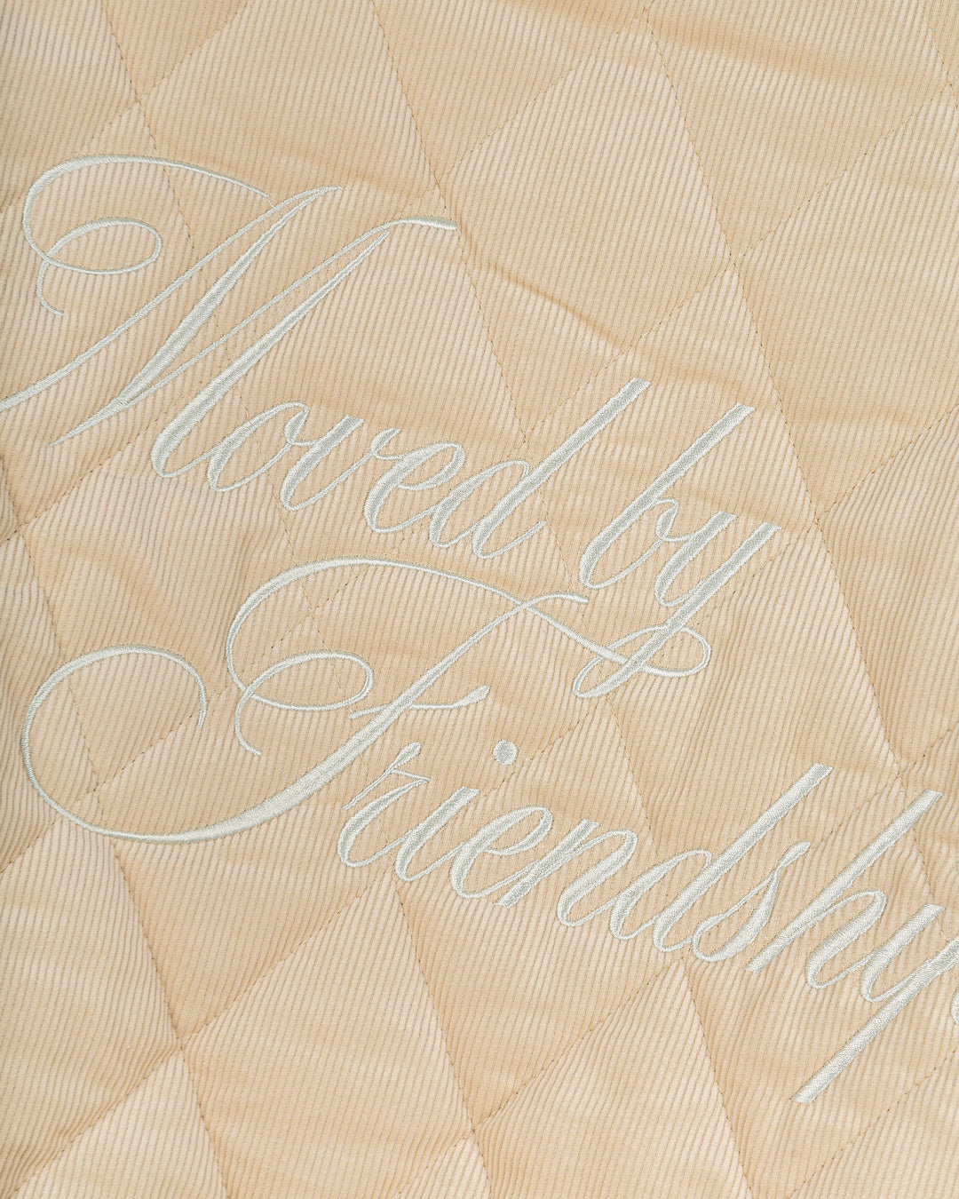 Classic style puffer jacket featuring diamond stitching for added texture. The exterior is crafted from soft corduroy, providing both comfort and durability, while the interior is made from smooth polyester for a cozy fit.