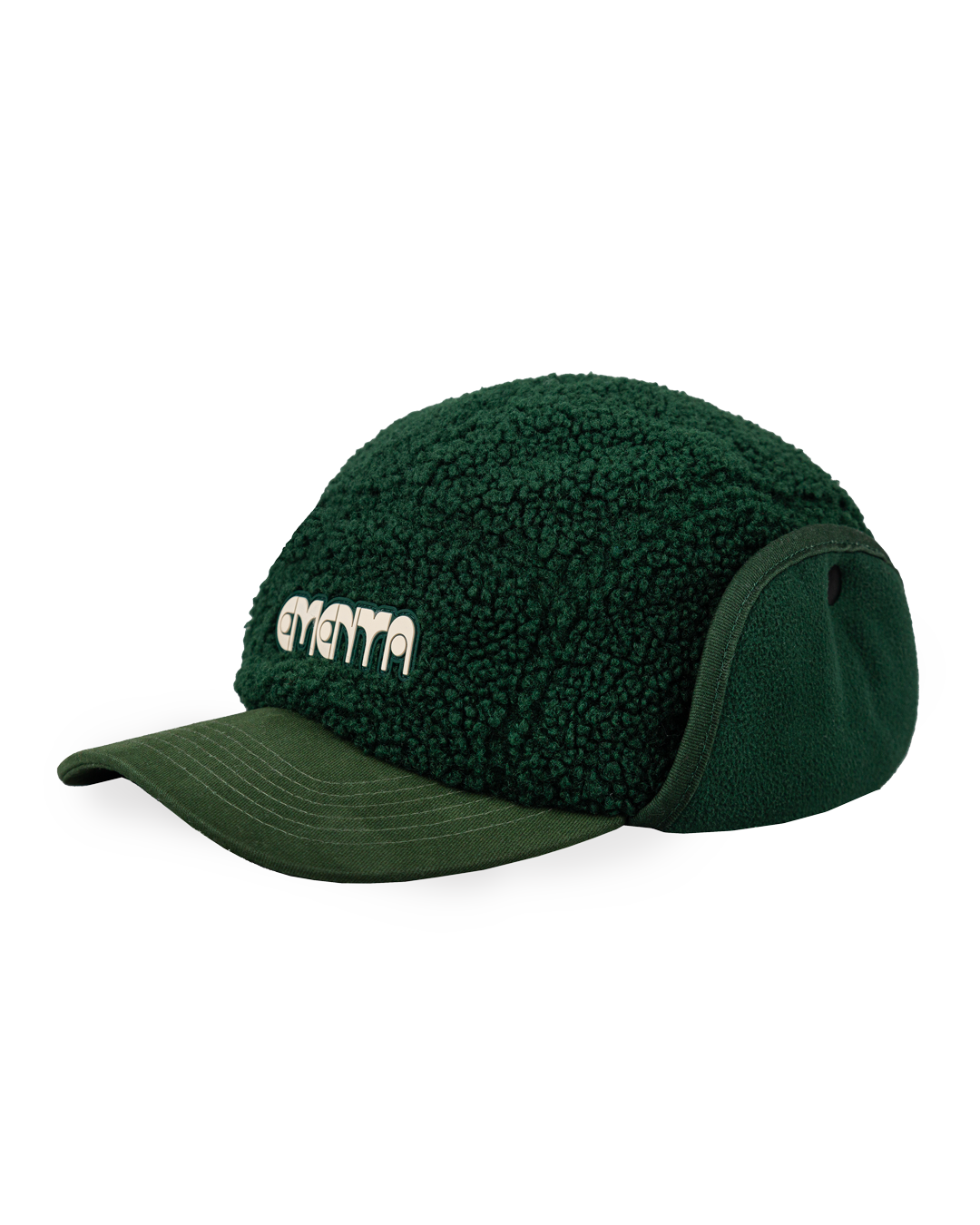 The Oreo Cap is a six-panel cap constructed with a sherpa outer shell for insulation and texture. It features ear flaps with a polar fleece lining on the inside for additional warmth and comfort. The flaps can be worn up or down, allowing for adjustable coverage. The cap has a curved brim that maintains its shape. The front panel displays the Dots Ementa logo.