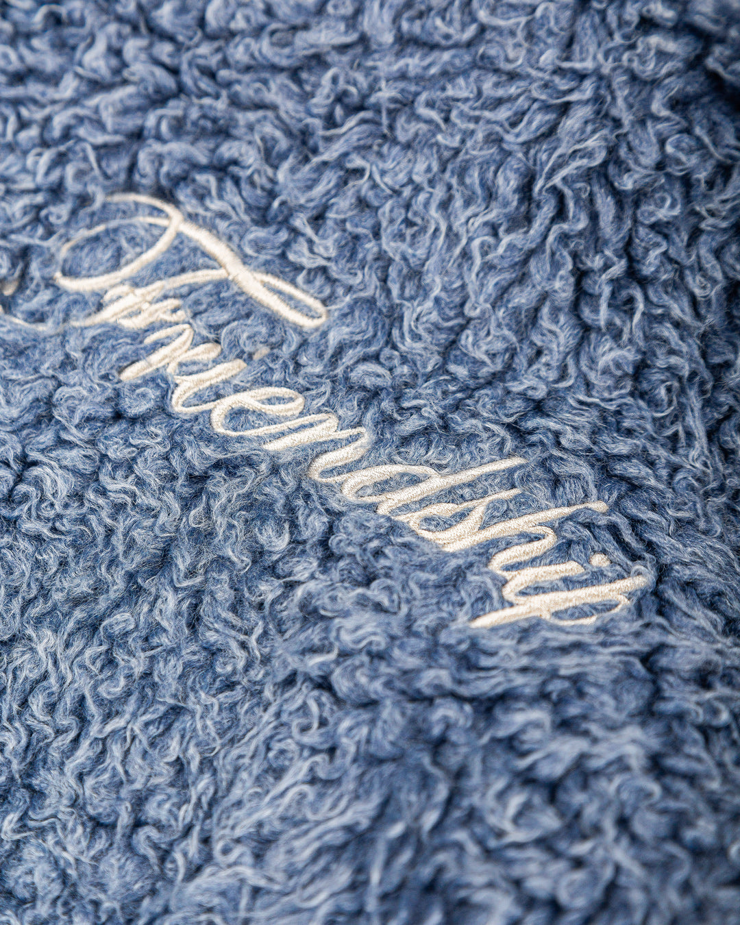 The Poncha Jacket is designed for warmth and comfort with its soft blue fur exterior. Inside, it features diamond stitching for added texture and durability.
It offers adjustable wrists and hips for a customizable fit, along with two exterior pockets and an interior pocket for convenient storage.