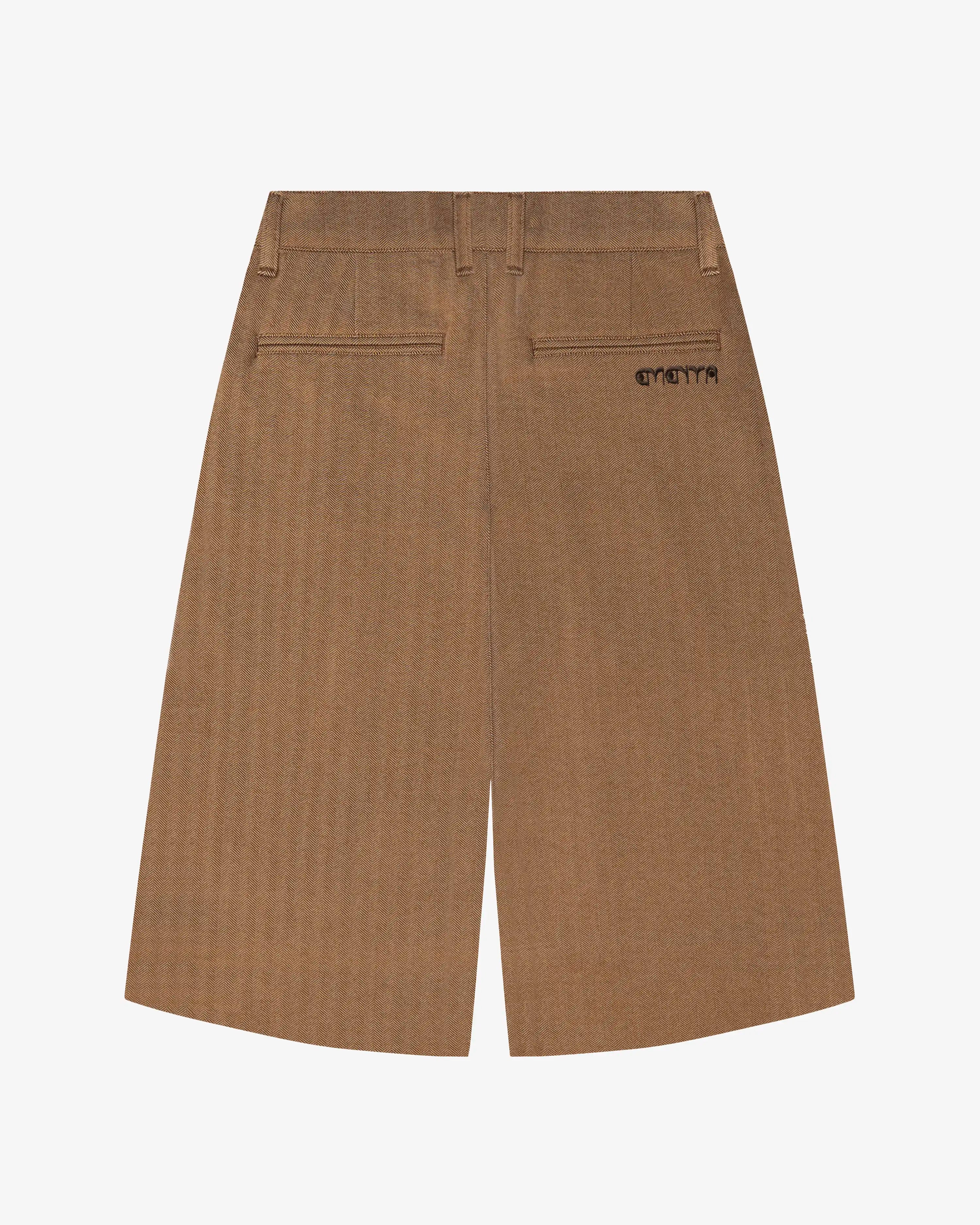 Back view of camel knit shorts with embroidered logo detail