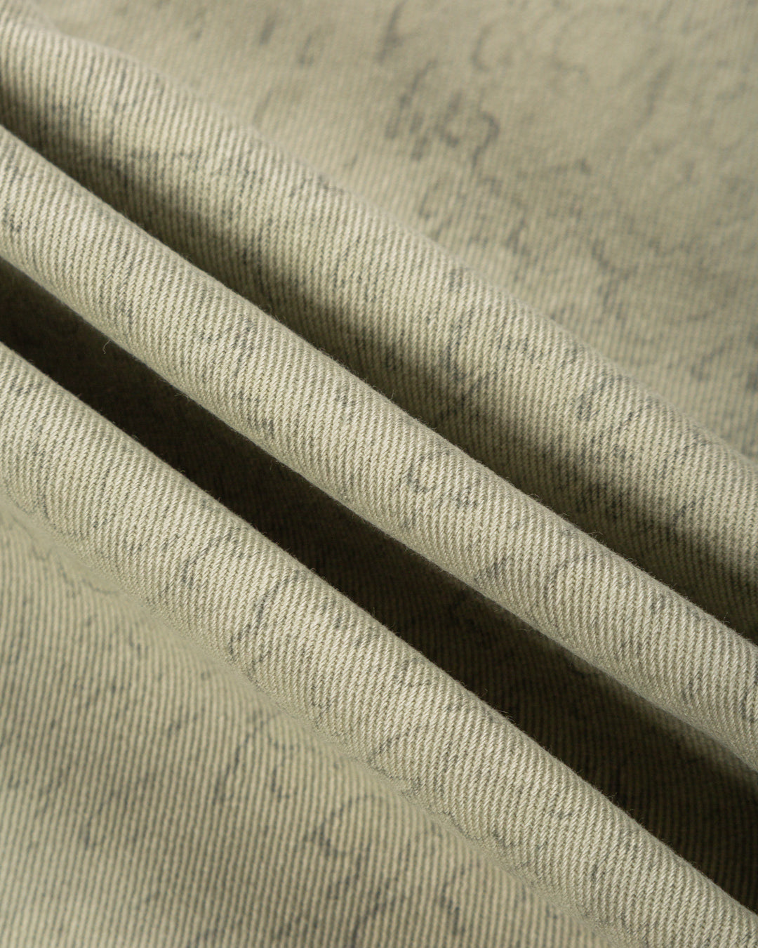 Relaxed-fit twill pants made from dyed green rag twill fabric, designed for comfort and durability with a focus on providing the perfect fit. The pants feature the cocktail design embroidered on the back pocket for added detail. Equipped with two back pockets and two front pockets.