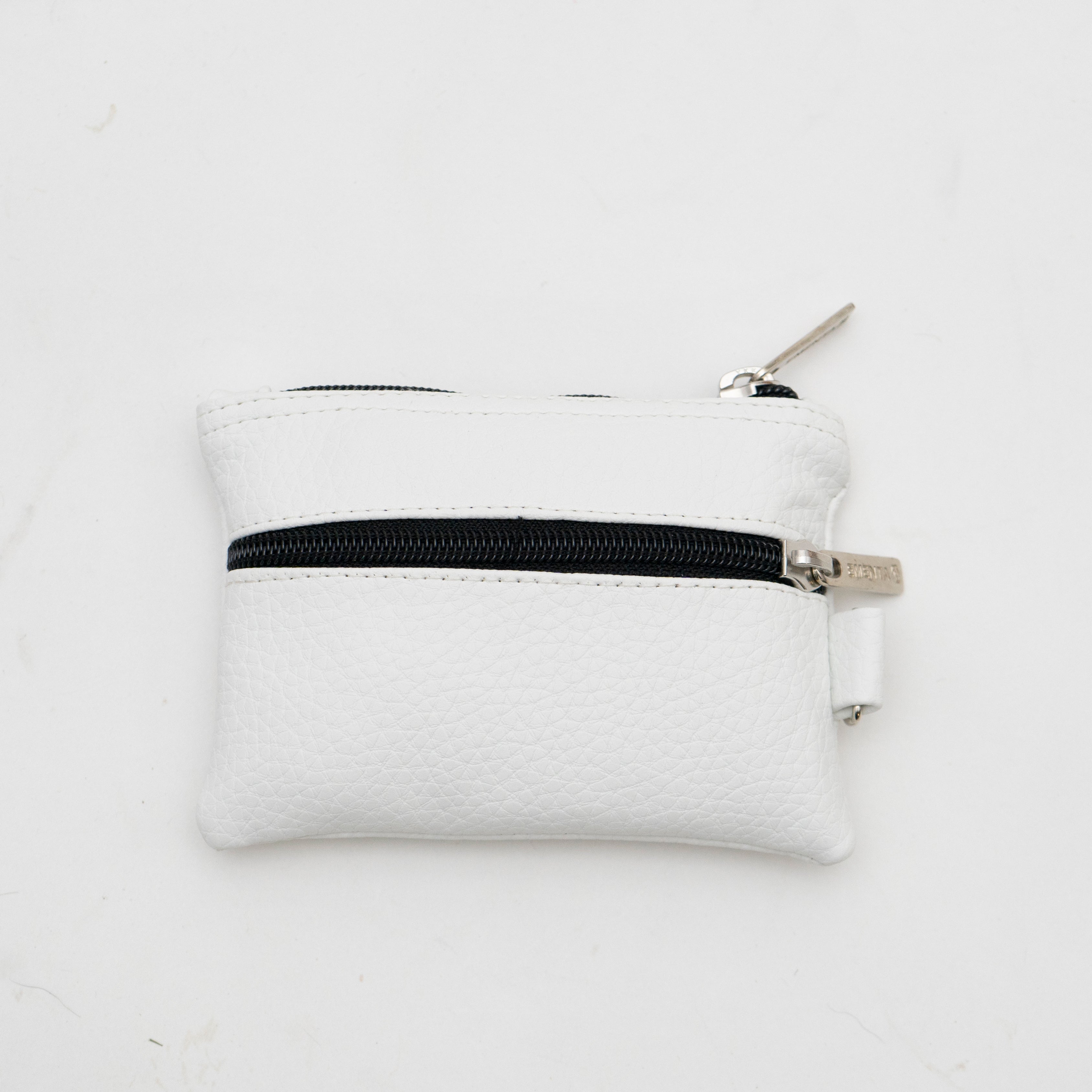 The Cota Wallet is a must-have to hold all your cards and coins.
The synthetic leather material is designed with a liquid-repellent coating for added durability.