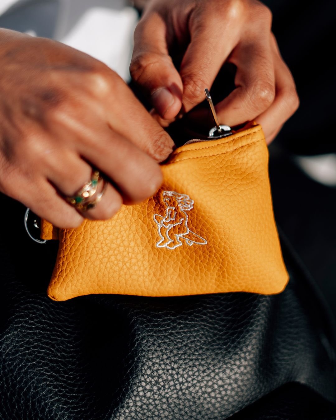 The Cota Wallet is a must-have to hold all your cards and coins.
The synthetic leather material is designed with a liquid-repellent coating for added durability.