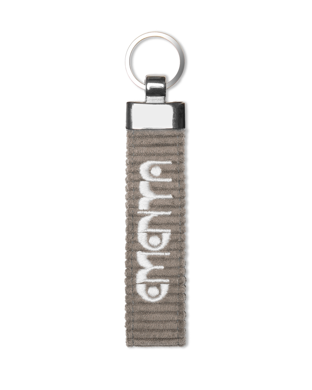 A corduroy keychain with the Ementa Dots logo in a metal finish.
Comes with a sturdy key ring. 
Simple, durable, and easy to carry.
The corduroy band measures 10,5cm in width and 2,5cm in length.
