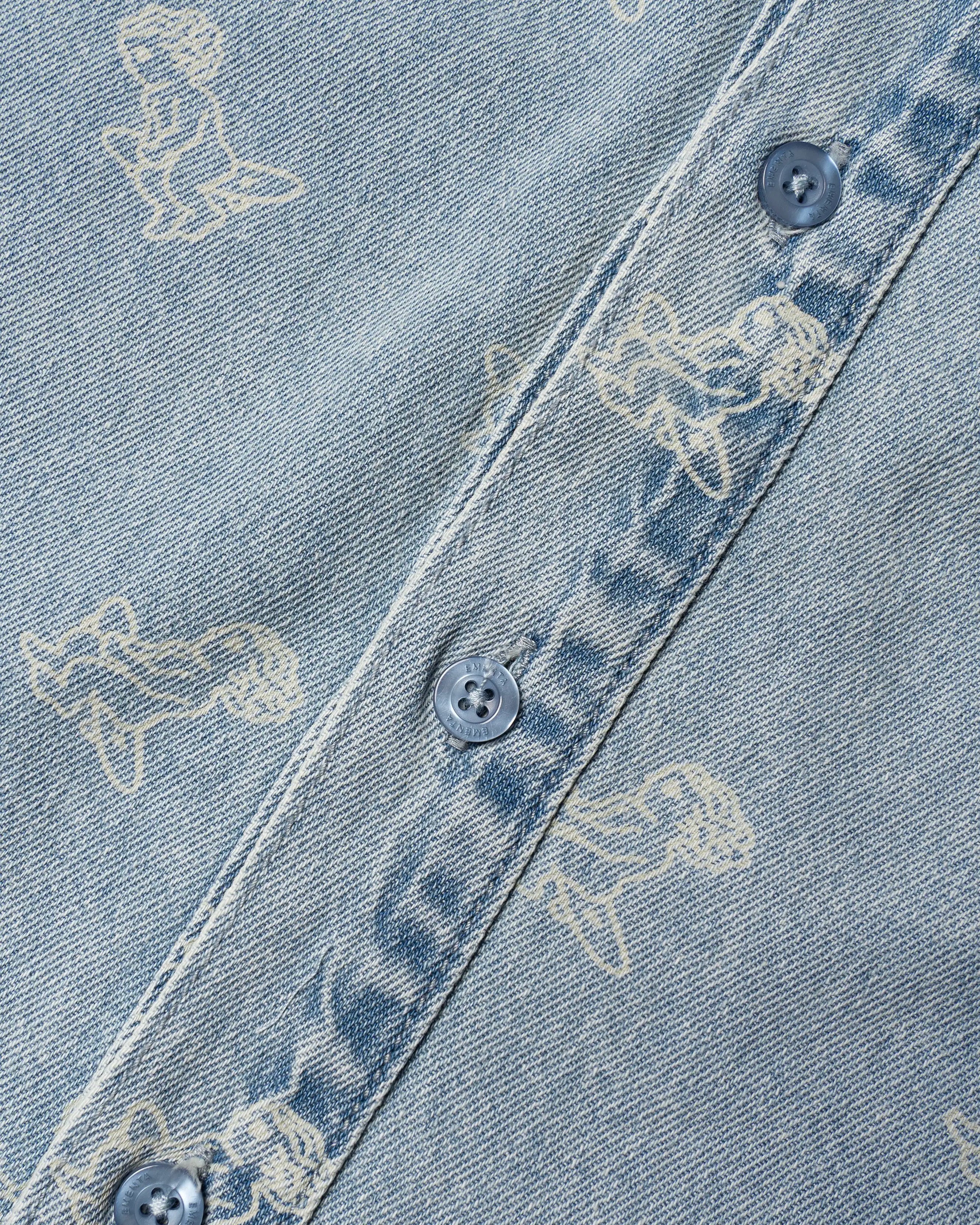 Light blue denim with all-over Ikon logo
Made from 100% cotton for a soft, breathable feel
Short-sleeved construction with a single chest pocket
Button front closure with tonal stitching
Slightly dropped shoulders for a relaxed silhouette
Unisex design
Cold wash only