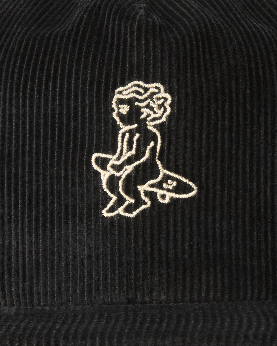 A flat five-panel cap in black, crafted from cotton corduroy for a structured yet comfortable fit. Designed with a rigid, flat brim and a lined front panel, it features top seams for added detail. The embroidered Ikon logo on the front adds a subtle touch, while the adjustable strap with a metal buckle ensures a customized fit.