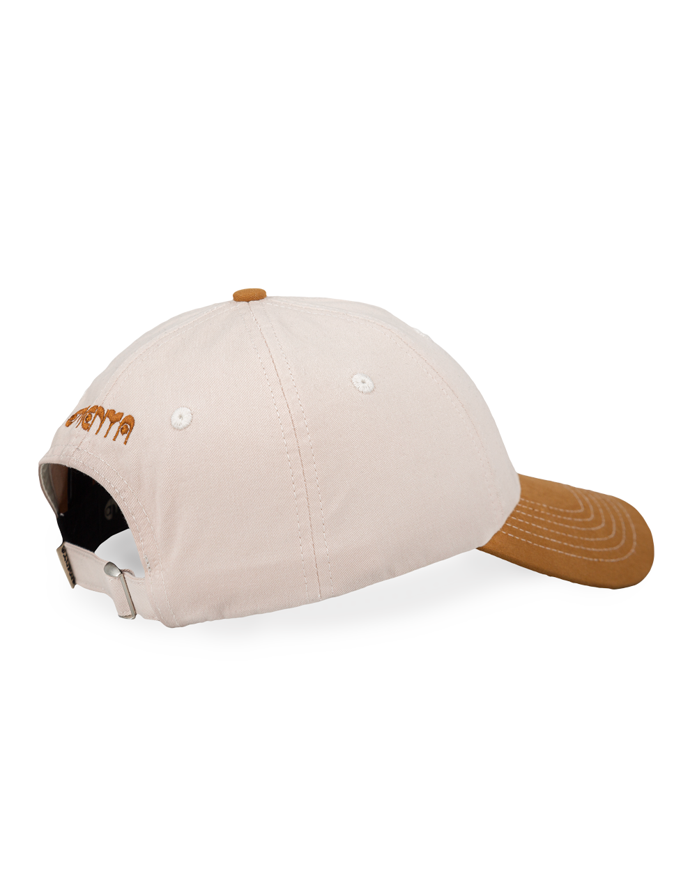Off-white crown, camel brim, white stitching holding it all together. The Ikon Flower is embroidered on the front, the kind of detail that makes you look twice. On the side, "Moved by Friendship" is stitched in, a reminder of what really matters. Around back, the Dots logo sits above the adjustable strap—small details that tie it all together.