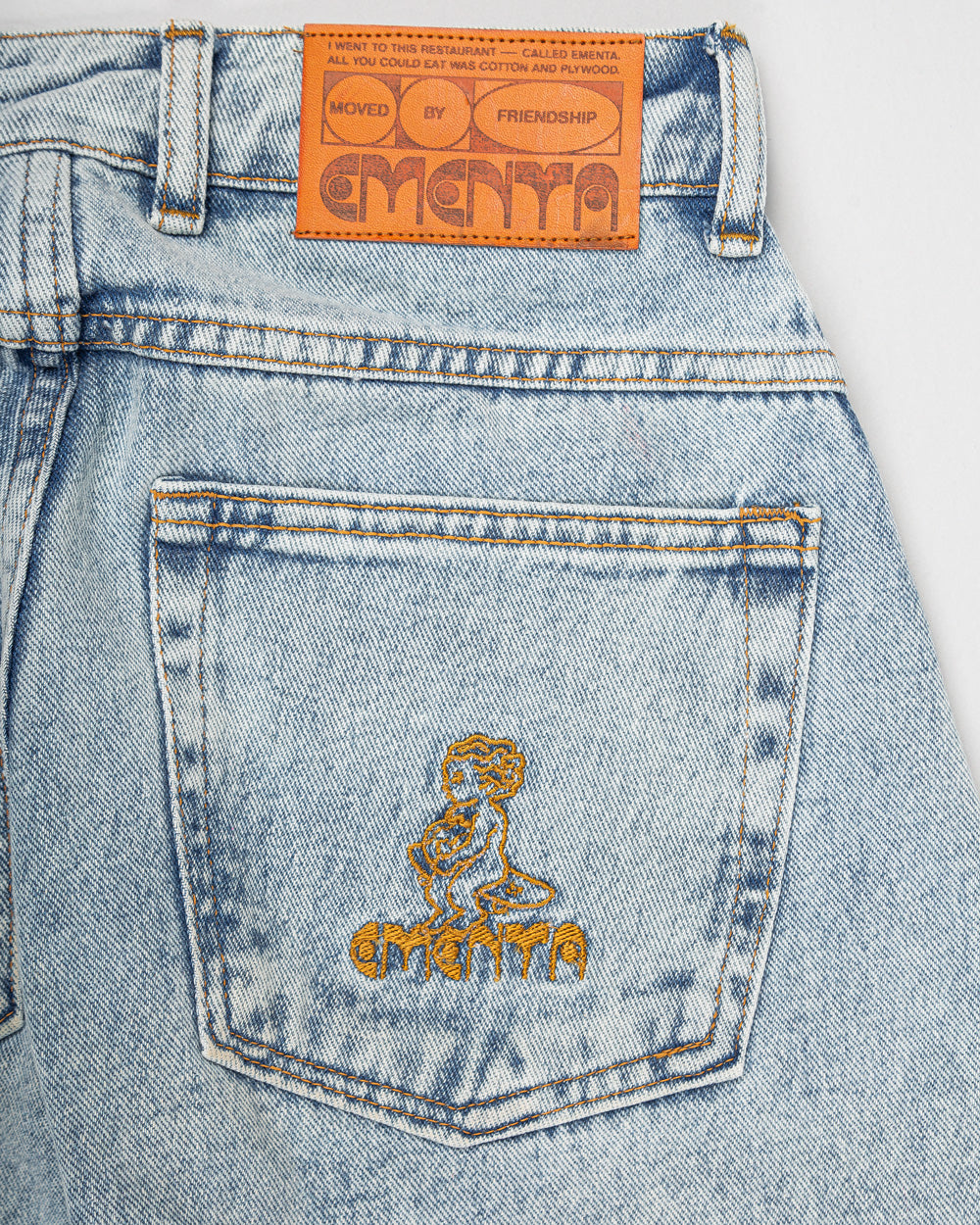 Relaxed-fit jeans made from blue fade-out, strong bleached denim, designed for comfort and durability. The jeans feature embroidered logos on the front and back, combining functionality with a clean, simple design.