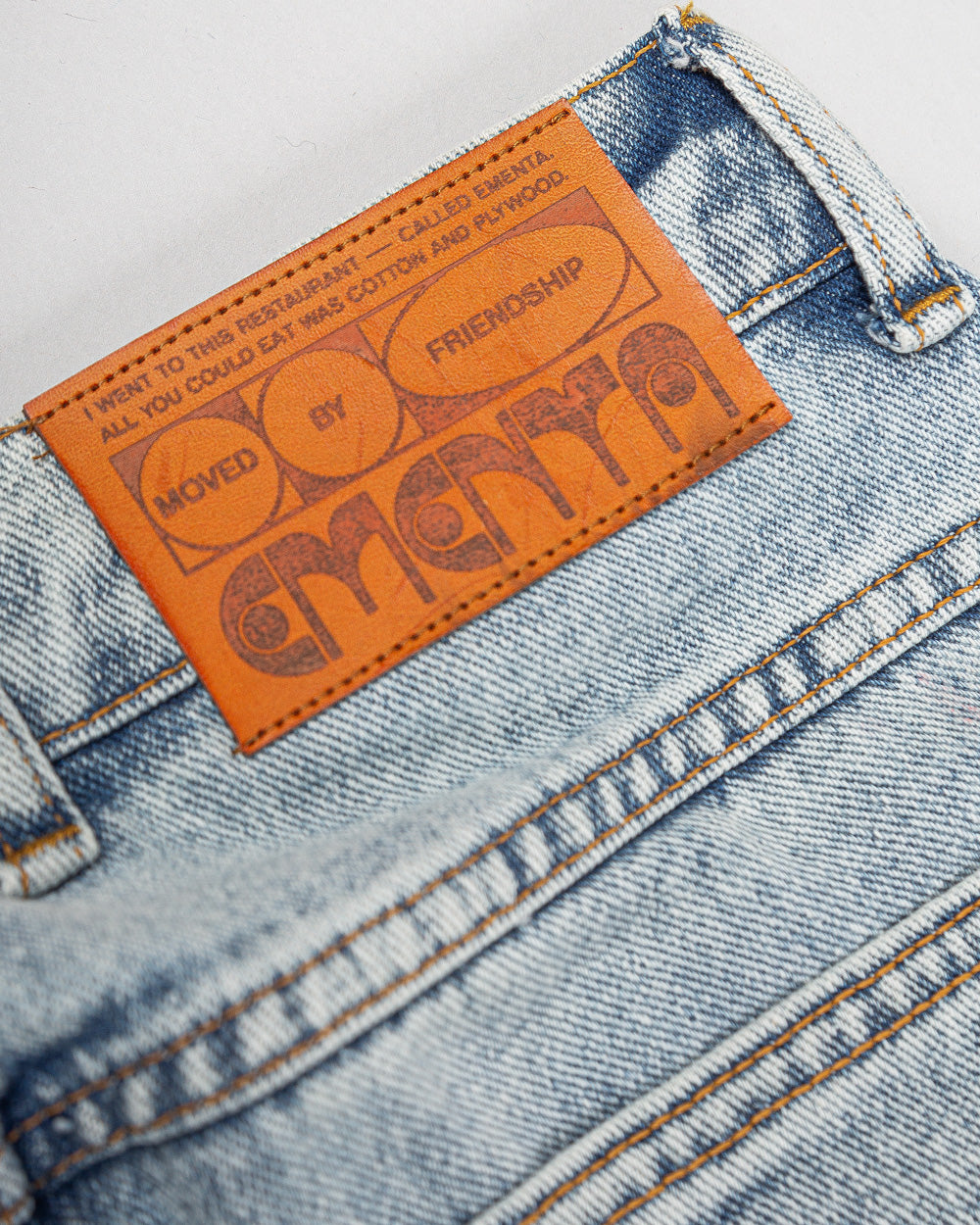 Relaxed-fit jeans made from blue fade-out, strong bleached denim, designed for comfort and durability. The jeans feature embroidered logos on the front and back, combining functionality with a clean, simple design.