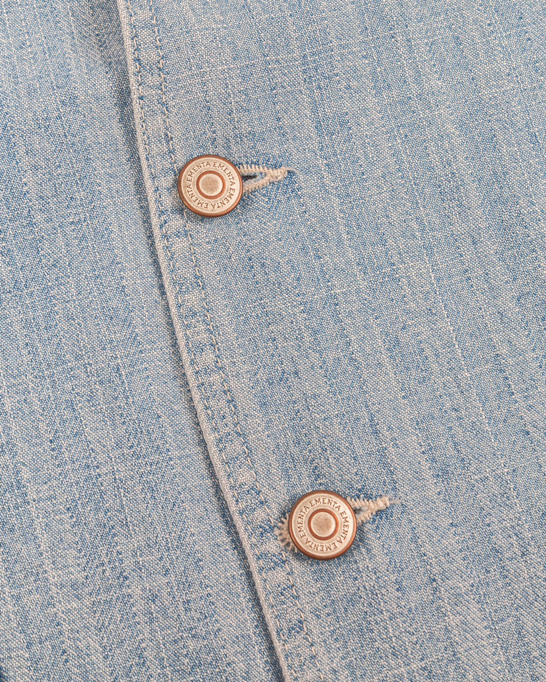 Denim striped vest made from soft, durable cotton fabric. The design features a striped denim pattern with an embroidered Ikon logo on the chest, combining texture and subtle branding.