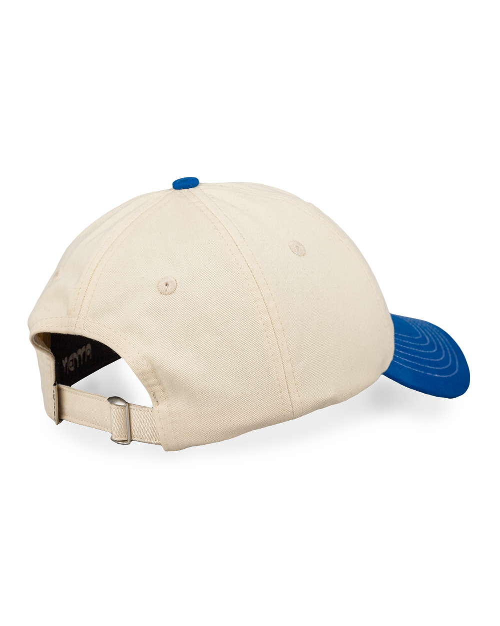 The Lisa Cap is a classic six-panel cap crafted from durable 100% cotton twill, inspired by Lisbon’s cultural heritage. It features an off-white crown and a royal blue curved brim, with visible white stitching. The front panel showcases the Ementa Dots logo embroidered in royal blue, while the side is adorned with the Lisa design, a tribute to Lisbon’s iconic tiles and swallows. An adjustable back strap ensures a comfortable and customizable fit, making this cap a timeless and versatile addition to any ward