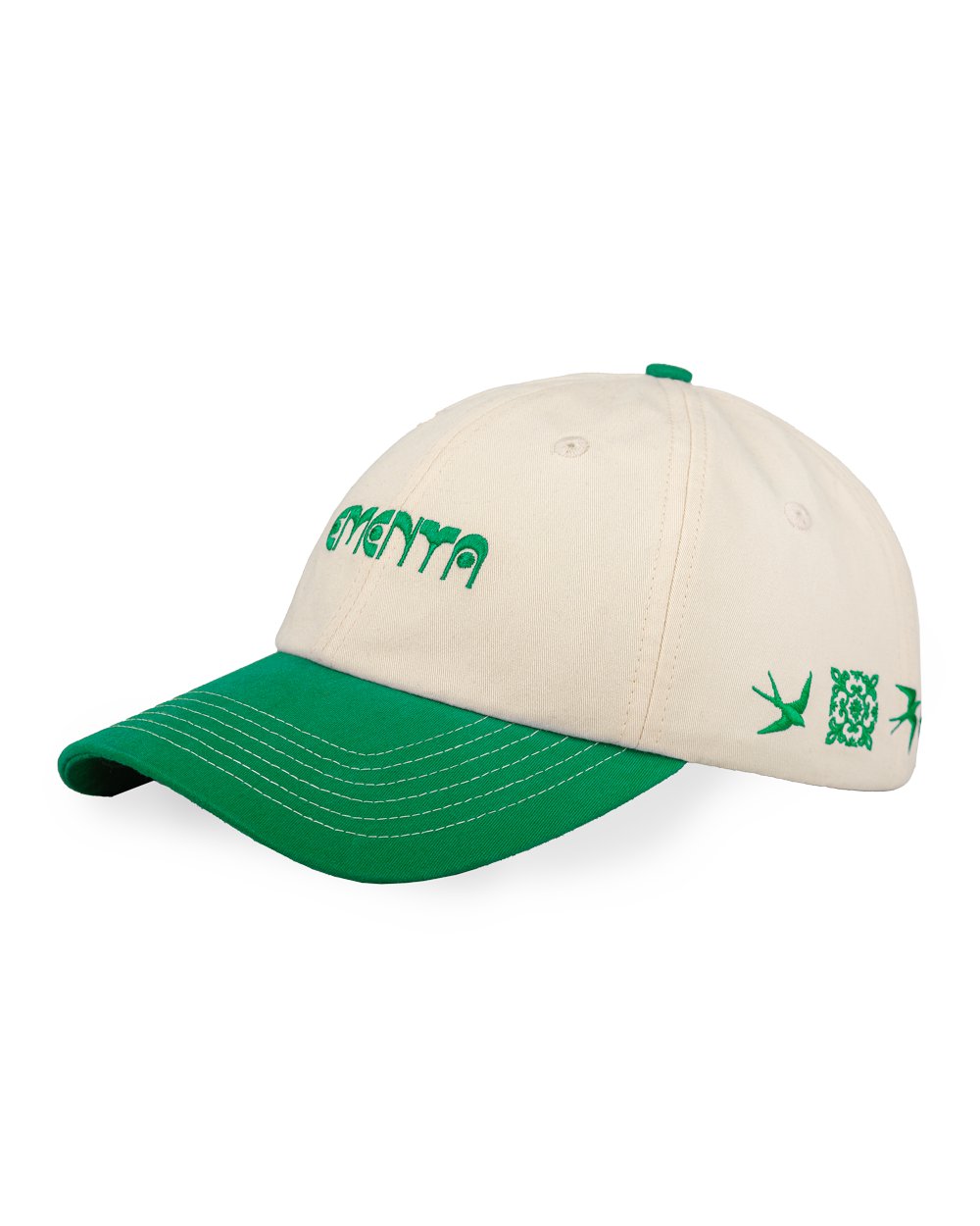 The Lisa Cap is a classic six-panel cap crafted from durable 100% cotton twill, inspired by Lisbon’s cultural heritage. It features an off-white crown with a green curved brim, with visible white stitching. The front panel showcases the Ementa Dots logo embroidered in green, while the side is adorned with the Lisa design, a tribute to Lisbon’s iconic tiles and swallows. An adjustable back strap ensures a comfortable and customizable fit, making this cap a timeless and versatile addition to any wardrobe.