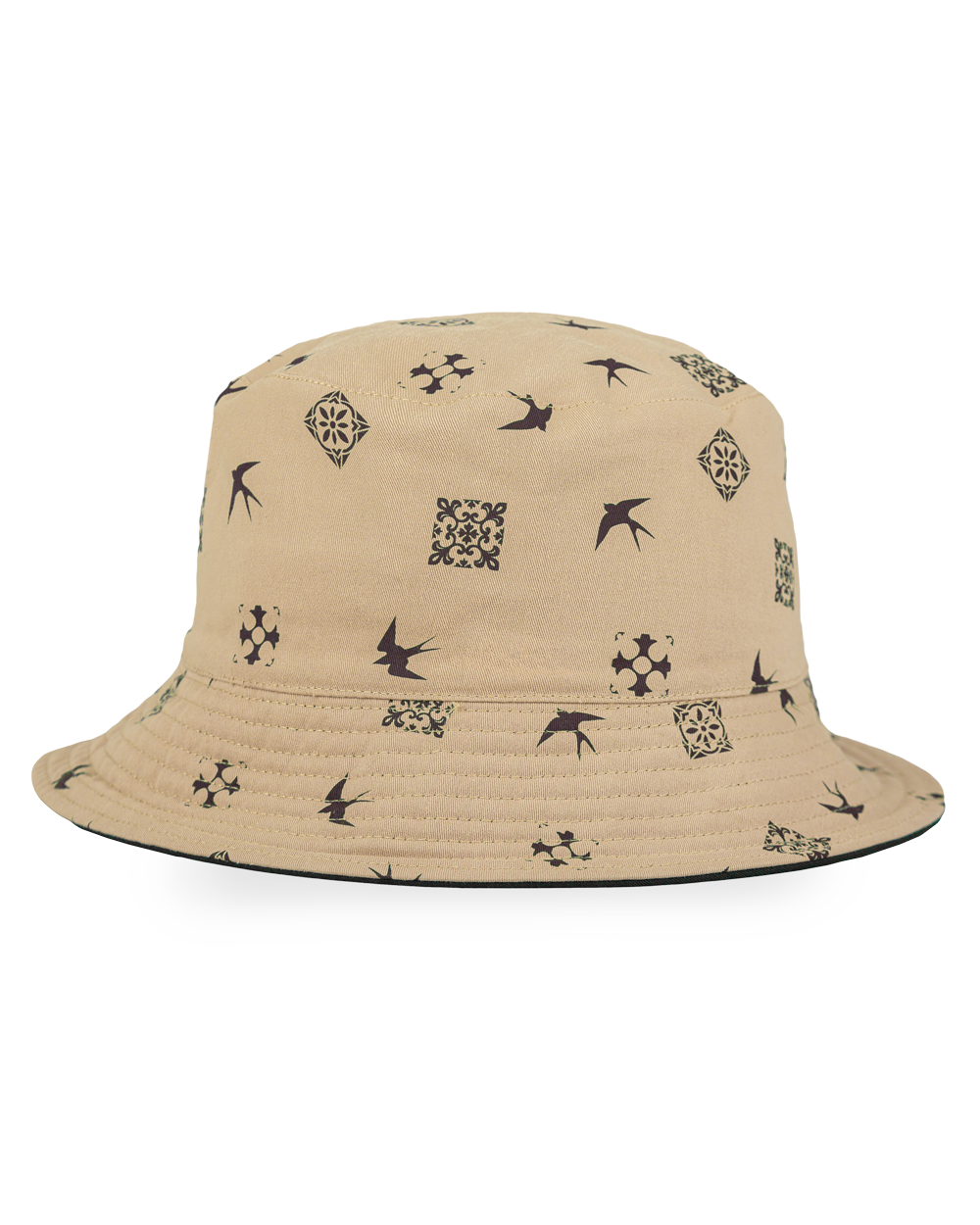 The Lisa Reversible Bucket Hat is inspired by Lisbon’s rich culture, featuring traditional tiles and swallows. One side is crafted in a warm brown tone with an embroidered Ementa Dots logo and a swallow detail, while the reverse side is off-white, adorned with a brown pattern of Lisbon’s iconic tiles and swallows. Made from durable 100% cotton twill, this hat offers breathability and comfort, making it a versatile piece for everyday wear.