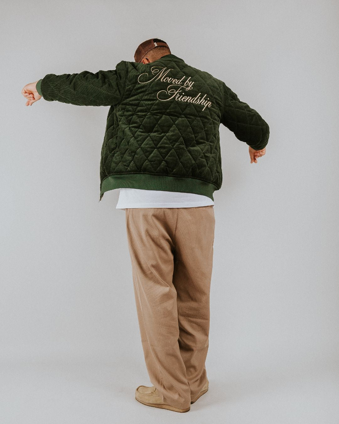 Classic style corduroy puffer jacket in green featuring diamond stitching for added texture. The exterior is crafted from soft corduroy, providing both comfort and durability, while the interior is made from smooth polyester for a cozy fit.