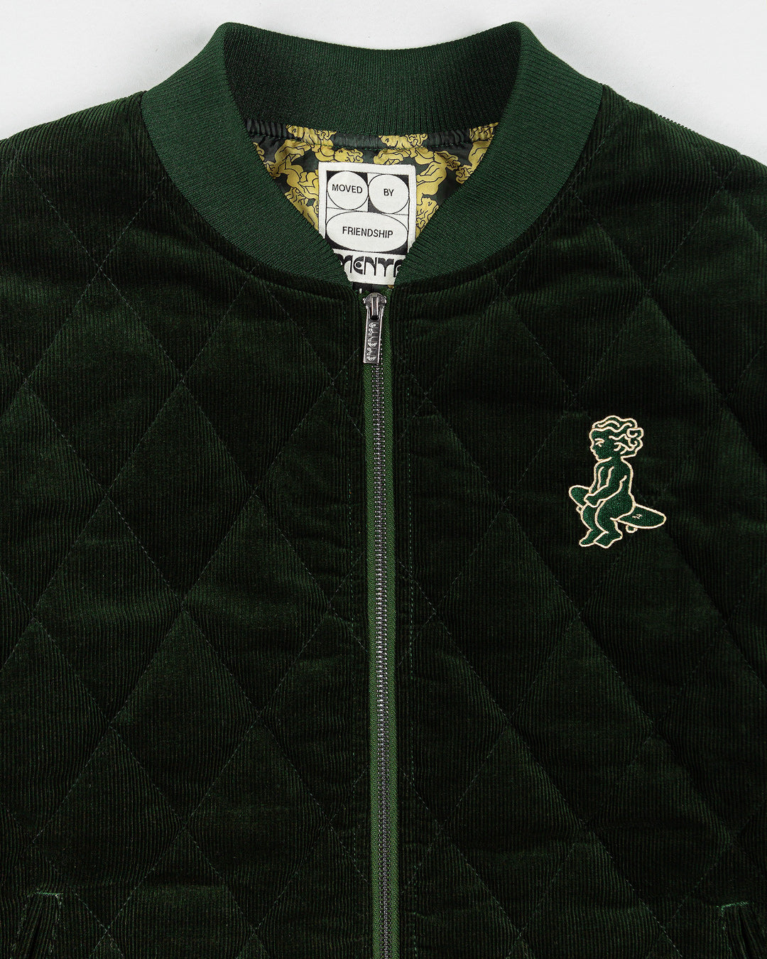 Classic style corduroy puffer jacket in green featuring diamond stitching for added texture. The exterior is crafted from soft corduroy, providing both comfort and durability, while the interior is made from smooth polyester for a cozy fit.