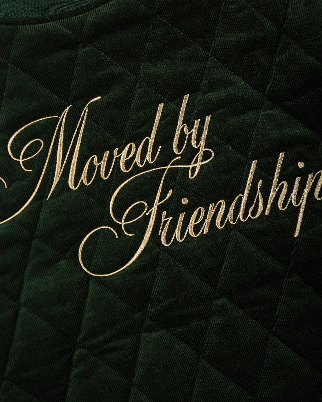 Classic style corduroy puffer jacket in green featuring diamond stitching for added texture. The exterior is crafted from soft corduroy, providing both comfort and durability, while the interior is made from smooth polyester for a cozy fit.