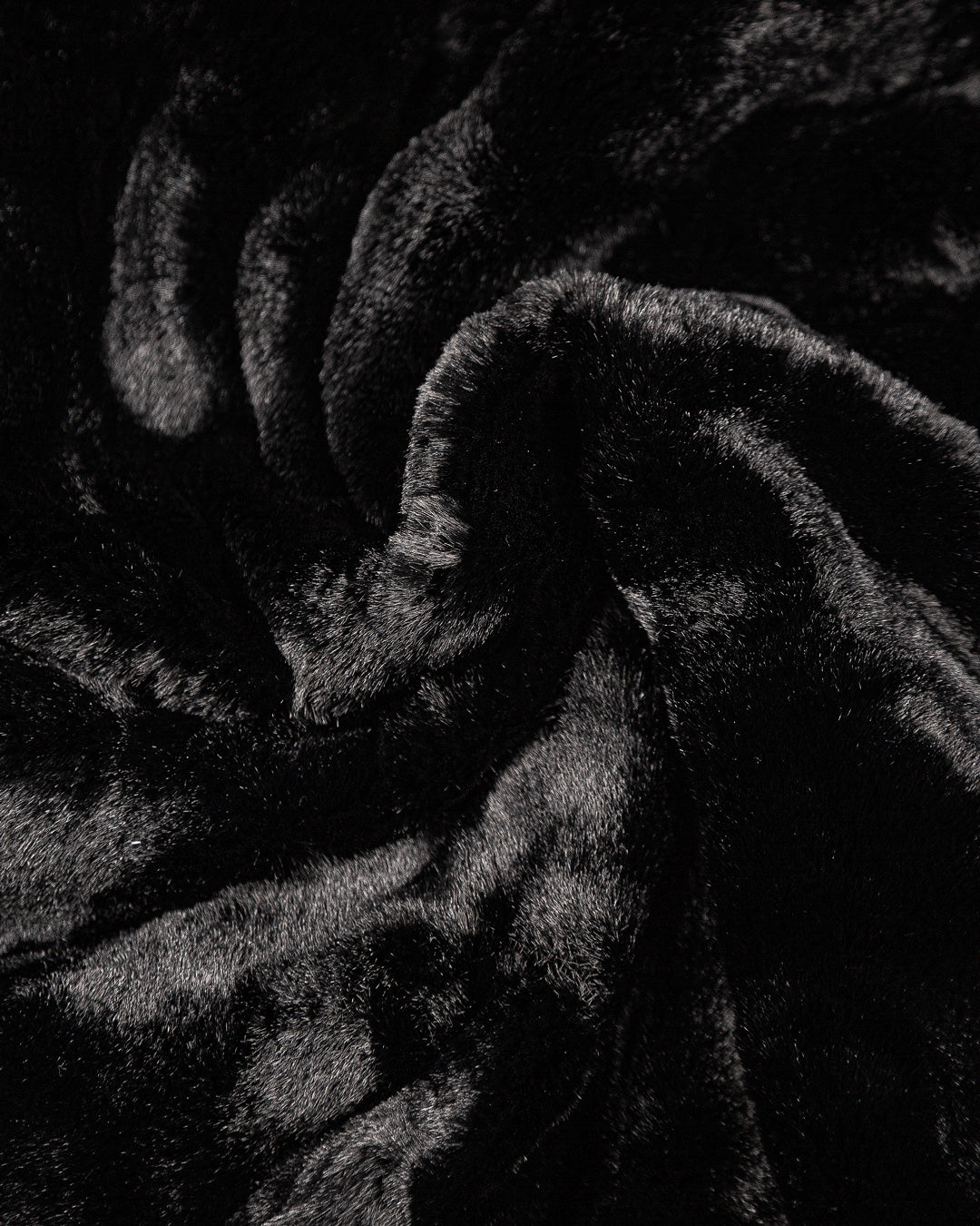 The Milaya Black Fur Jacket is designed for warmth and comfort, featuring a soft black fur exterior. Inside, it has diamond stitching for added texture and durability.
The jacket includes adjustable elasticated wrists and hips for a customizable fit, along with two exterior pockets and one interior pocket for storage.