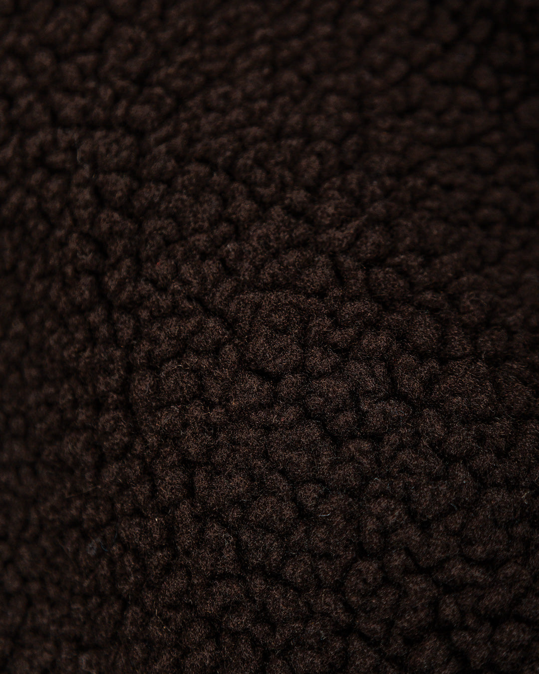 The Oreo Friendship Polar Jacket combines warmth and comfort with its thick brown polar exterior. Inside, puffed diamond stitching adds texture and durability, enhancing its cozy feel.
Elasticated wrists and hips provide a customizable fit, while two exterior pockets and one interior pocket offer convenient storage. The chest features the motto "Moved by Friendship" embroidered, and the back showcases the dragged effect Ikon logo.