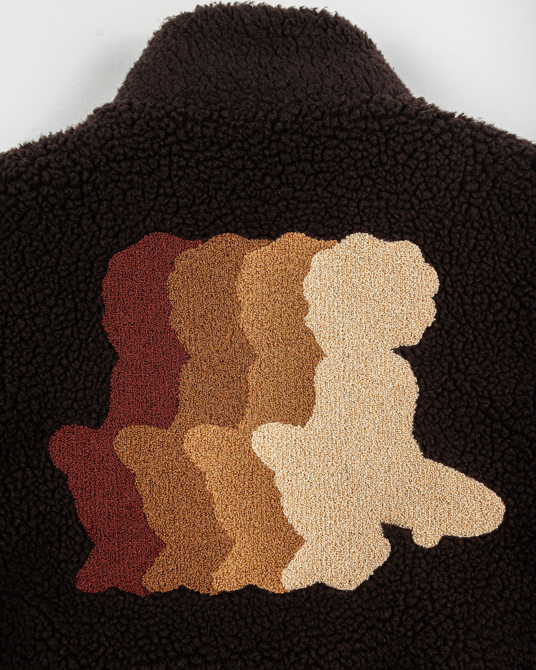 The Oreo Friendship Polar Jacket combines warmth and comfort with its thick brown polar exterior. Inside, puffed diamond stitching adds texture and durability, enhancing its cozy feel.
Elasticated wrists and hips provide a customizable fit, while two exterior pockets and one interior pocket offer convenient storage. The chest features the motto "Moved by Friendship" embroidered, and the back showcases the dragged effect Ikon logo.