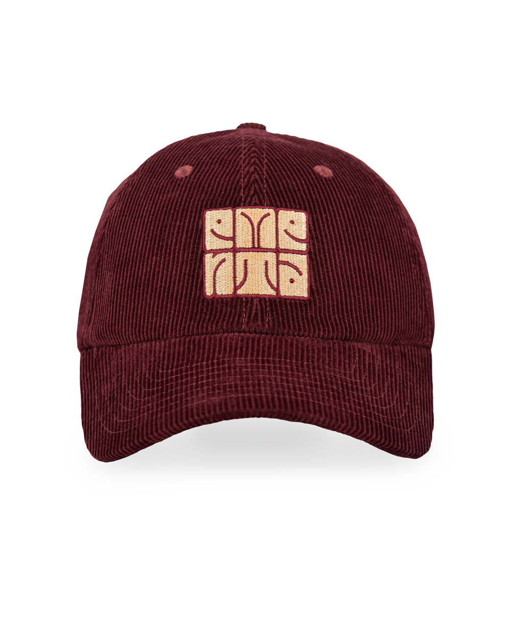 The Totem Cap is a classic six-panel cap crafted from 100% cotton corduroy, offering a soft texture and a timeless look. It comes in a burgundy color, complemented by a curved brim for a relaxed fit. The front features our new Ementa totem patch in beige, creating contrast against the burgundy background. 