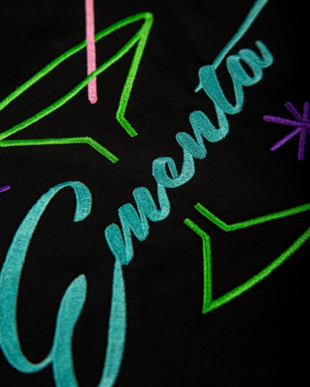 Artist-made t-shirt crafted from soft cotton fabric with a carefully balanced weight, providing a comfortable and natural fit. The embroidered 3D cocktail design adds a textured element to the t-shirt. 