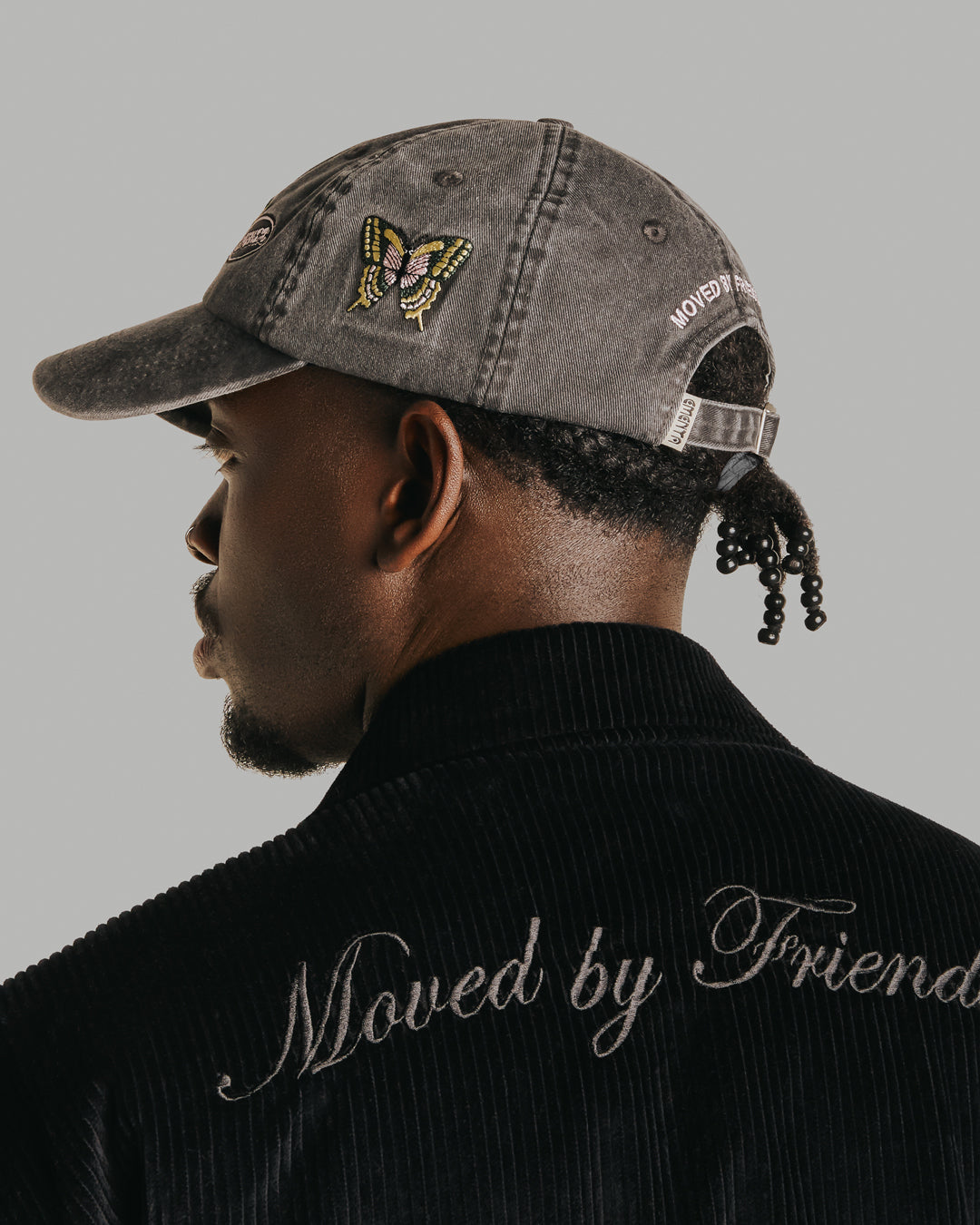 The Dots Patch Cap is a classic six-panel cap crafted from 100% cotton, ensuring a comfortable fit and durable wear. It comes in a sleek black color, enhanced by a curved brim. The cap is decorated with multiple embroidered patches, adding character to the design.
