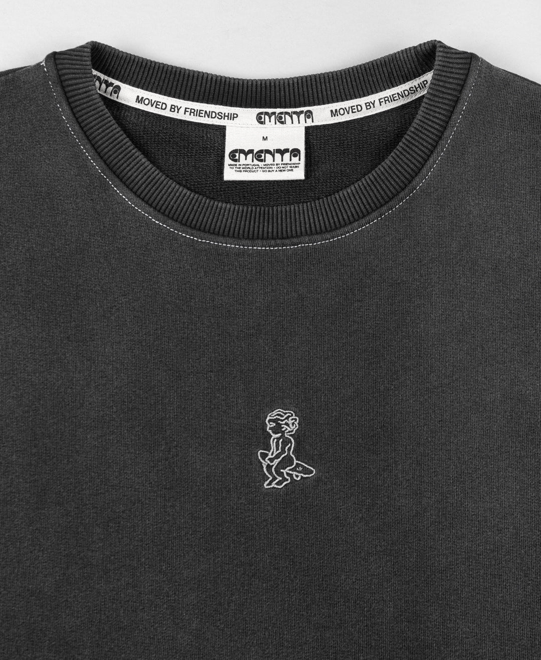 Cotton vest in grey washed, constructed from soft fabric, designed with a relaxed, loose fit for ease of movement. The vest features a subtle embroidered design on the chest, adding minimal detailing.