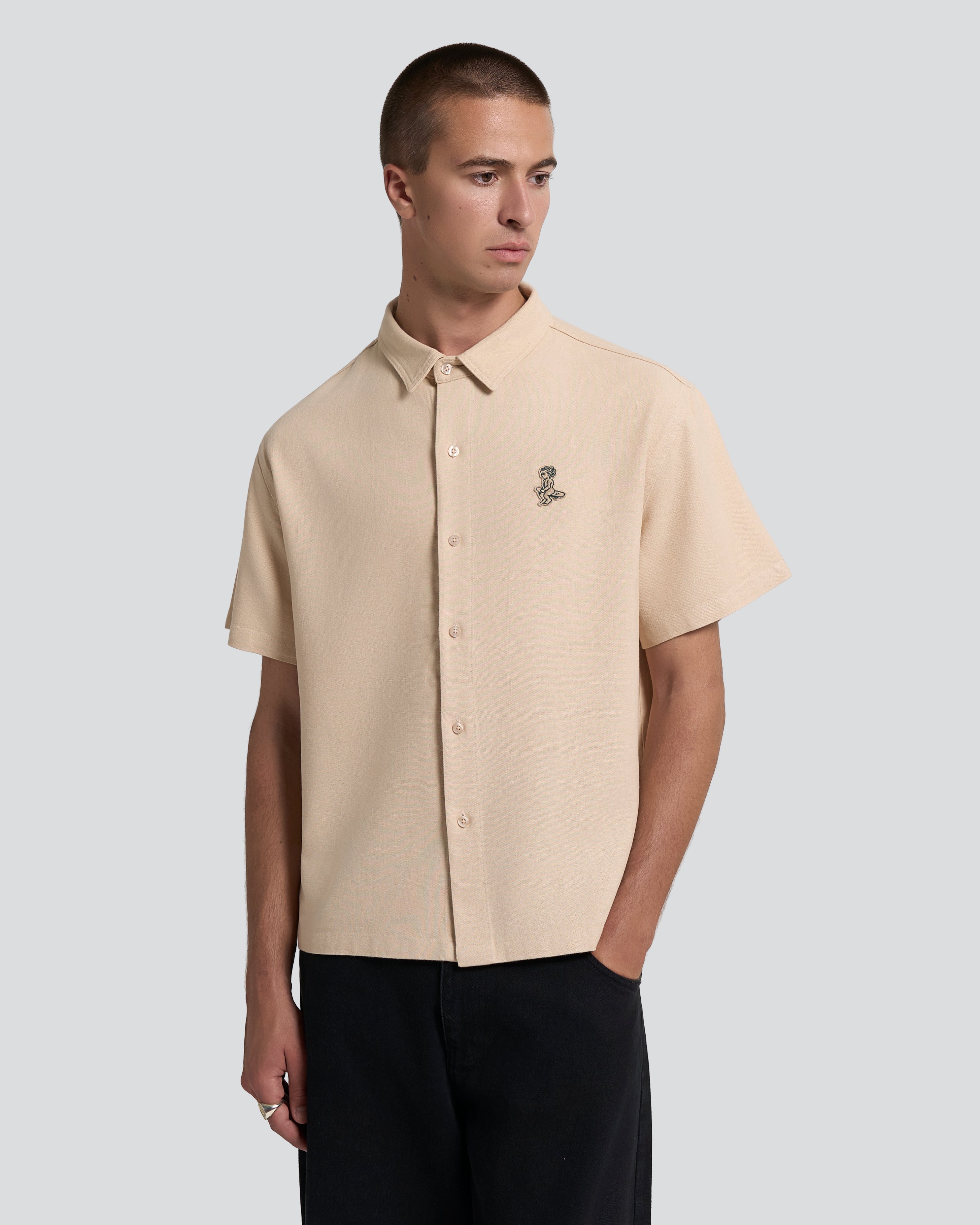 Short sleeve button-up shirt with a clean, structured appearance
100% cotton fabric with a textured weave and dry hand feel
Relaxed fit with a straight cut for ease of movement
Chest embroidered patch featuring the Ikon logo
Beige tone with tonal buttons