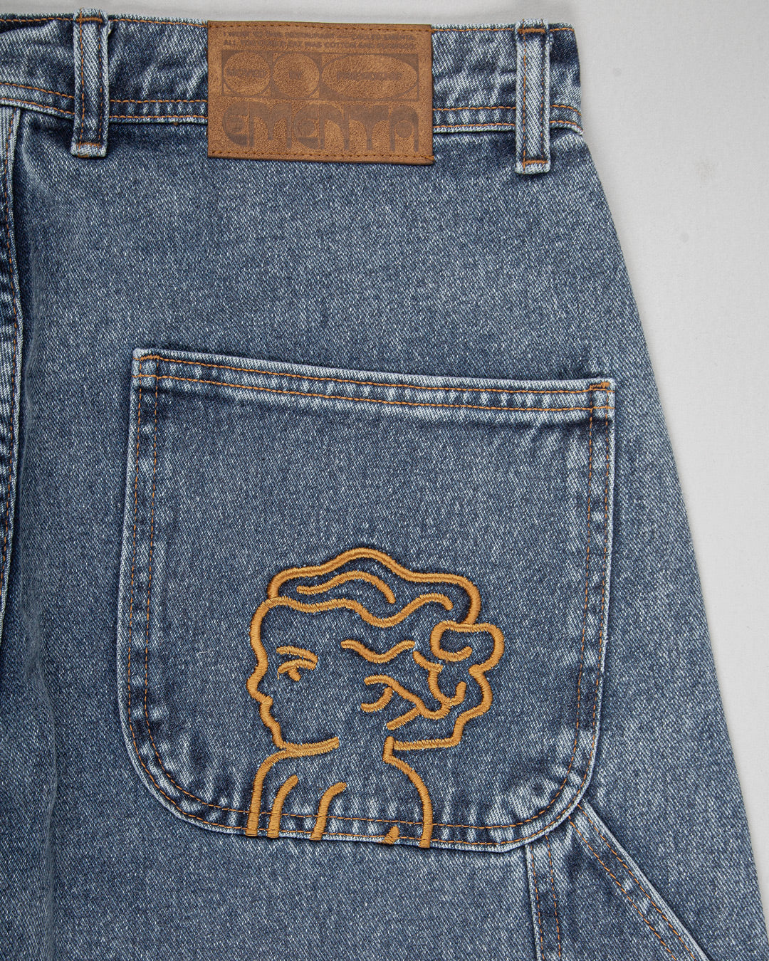 The Big Ikon Jeans Relaxed Fit Pants are designed with a baggy, relaxed straight fit and a mid-waist, offering comfort and ease of movement. The pants are crafted from blue fade-out denim, providing a timeless and durable look. They feature the Ikon logo embroidered in gold on the back pocket. The pants also include two front pockets, two back pockets, and one side pocket for practical storage.
