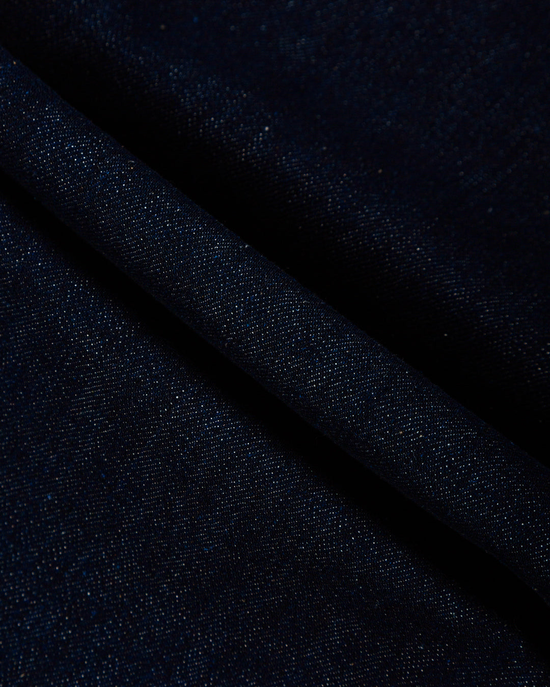 The Big Ikon Jeans Relaxed Fit Pants are designed with a baggy, relaxed straight fit and a mid-waist, offering comfort and ease of movement. The pants are crafted from blue raw denim, providing a timeless and durable look. They feature the Ikon logo embroidered in gold on the back pocket. The pants also include two front pockets, two back pockets, and one side pocket for practical storage.
