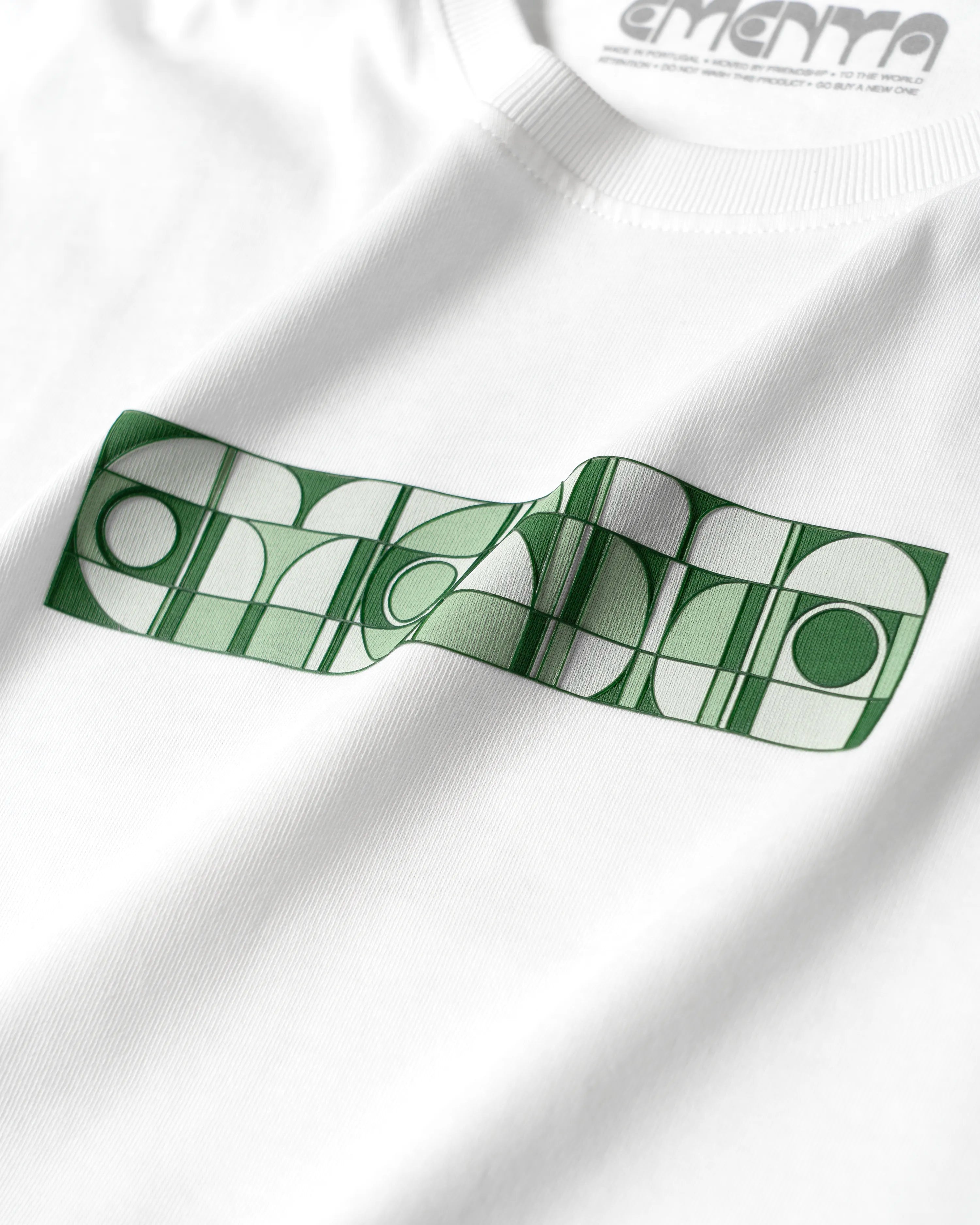 100% Cotton (220gsm)
Heavyweight cotton fabric with soft hand-feel
Boxy, relaxed fit with dropped shoulders
Ribbed crewneck collar
Screen-printed graphic on front and back
Artwork celebrates friendship and unity
"EMENTA© Moved By Friendship" motto on the back
Double-stitched hems for durability
Made in Portugal