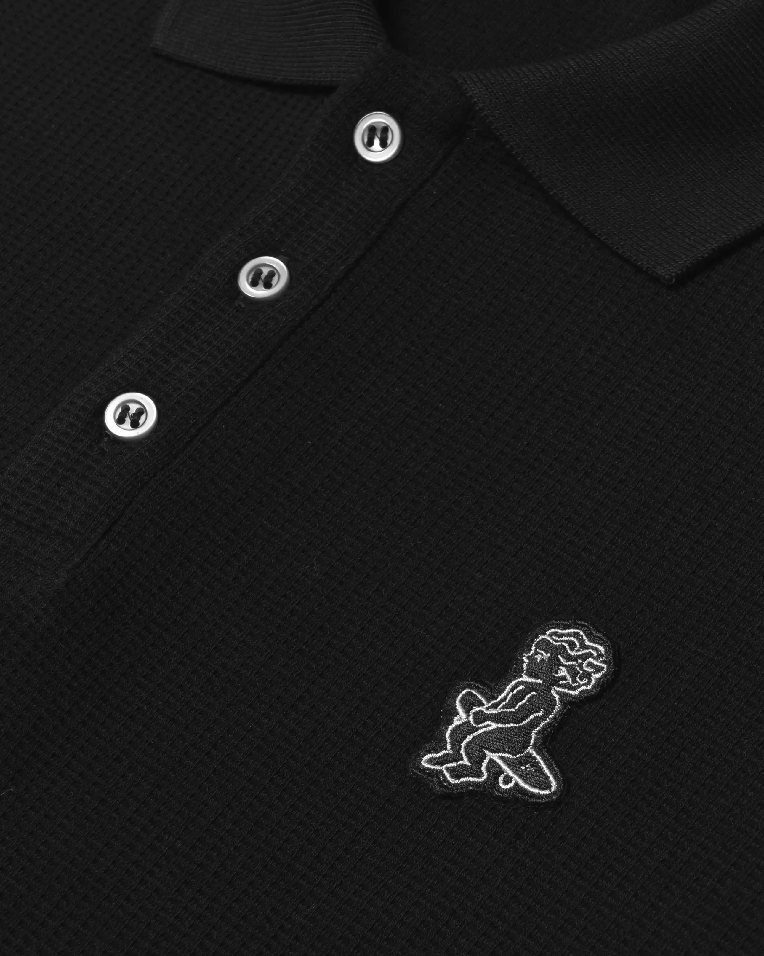 Ementa Polo Shirt
Waffle knit texture for enhanced breathability and structure
Ikon logo patch on the chest
Button-up front with four tonal buttons
Ribbed collar and sleeves
100% cotton
Regular fit
Unisex
Made in Portugal