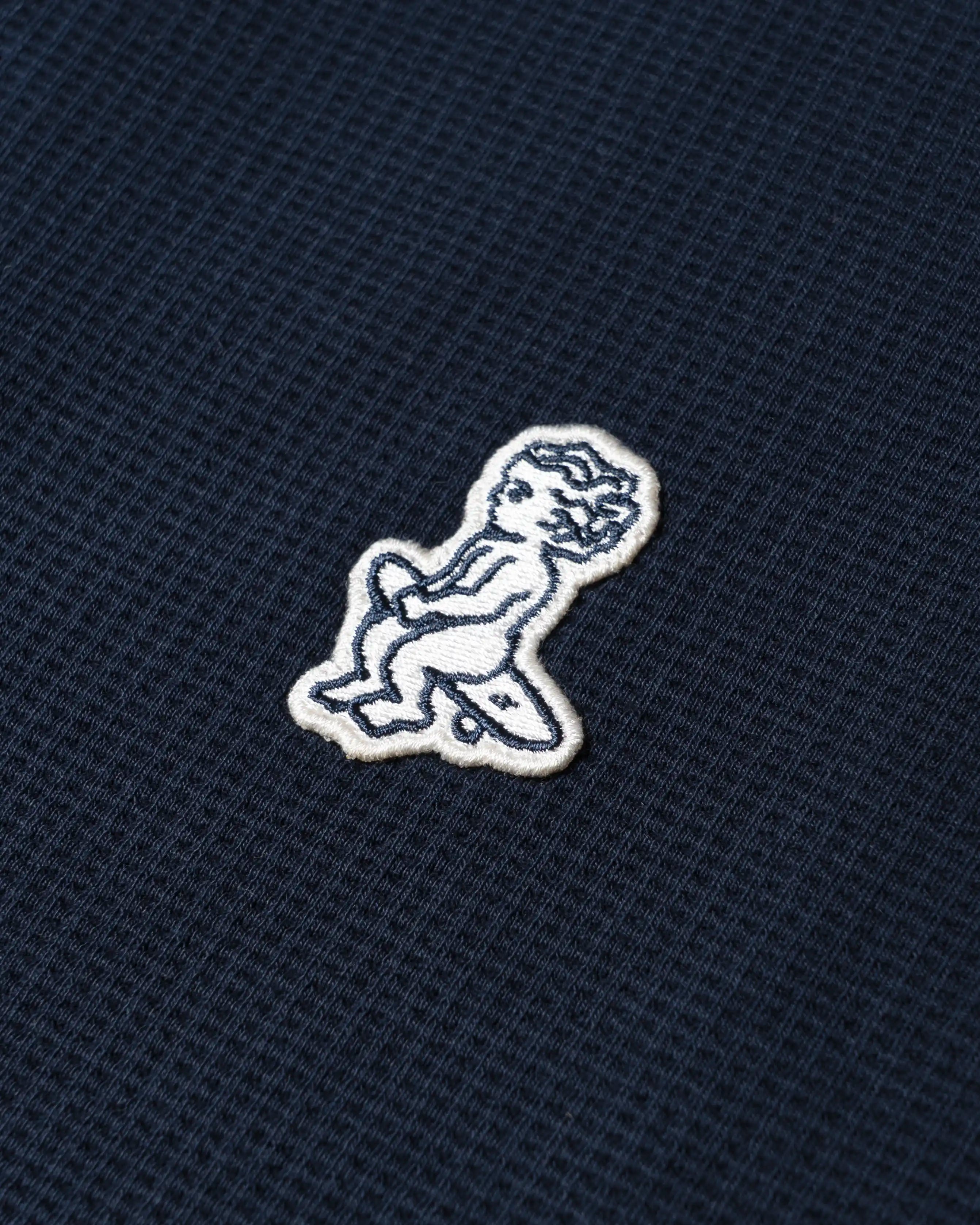 Ementa Polo Shirt
Waffle knit texture for enhanced breathability and structure
Embroidered Ikon logo on the chest
Button-up front with four tonal buttons
Ribbed collar and sleeves
100% cotton
Regular fit
Unisex
Made in Portugal