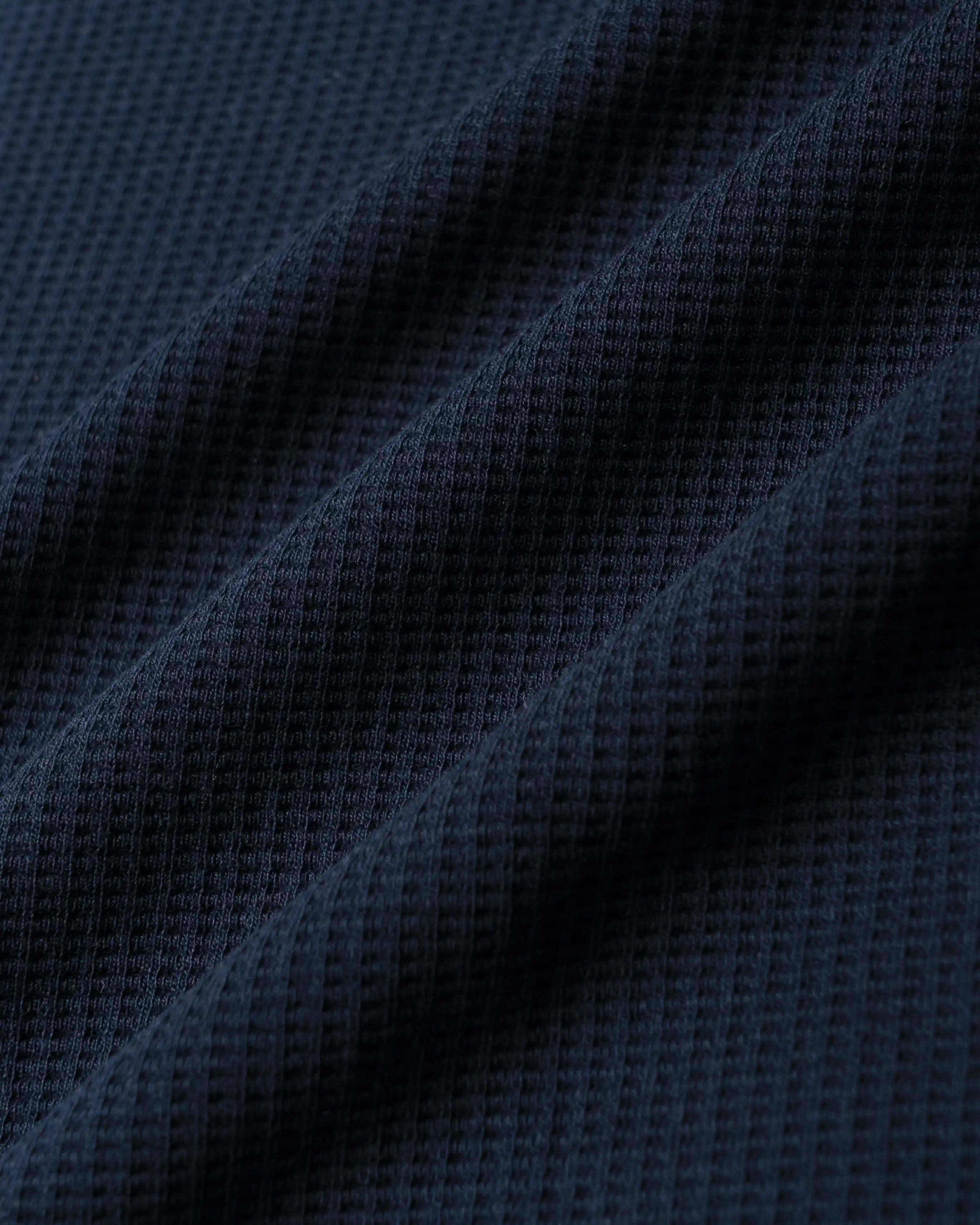 Ementa Polo Shirt
Waffle knit texture for enhanced breathability and structure
Embroidered Ikon logo on the chest
Button-up front with four tonal buttons
Ribbed collar and sleeves
100% cotton
Regular fit
Unisex
Made in Portugal