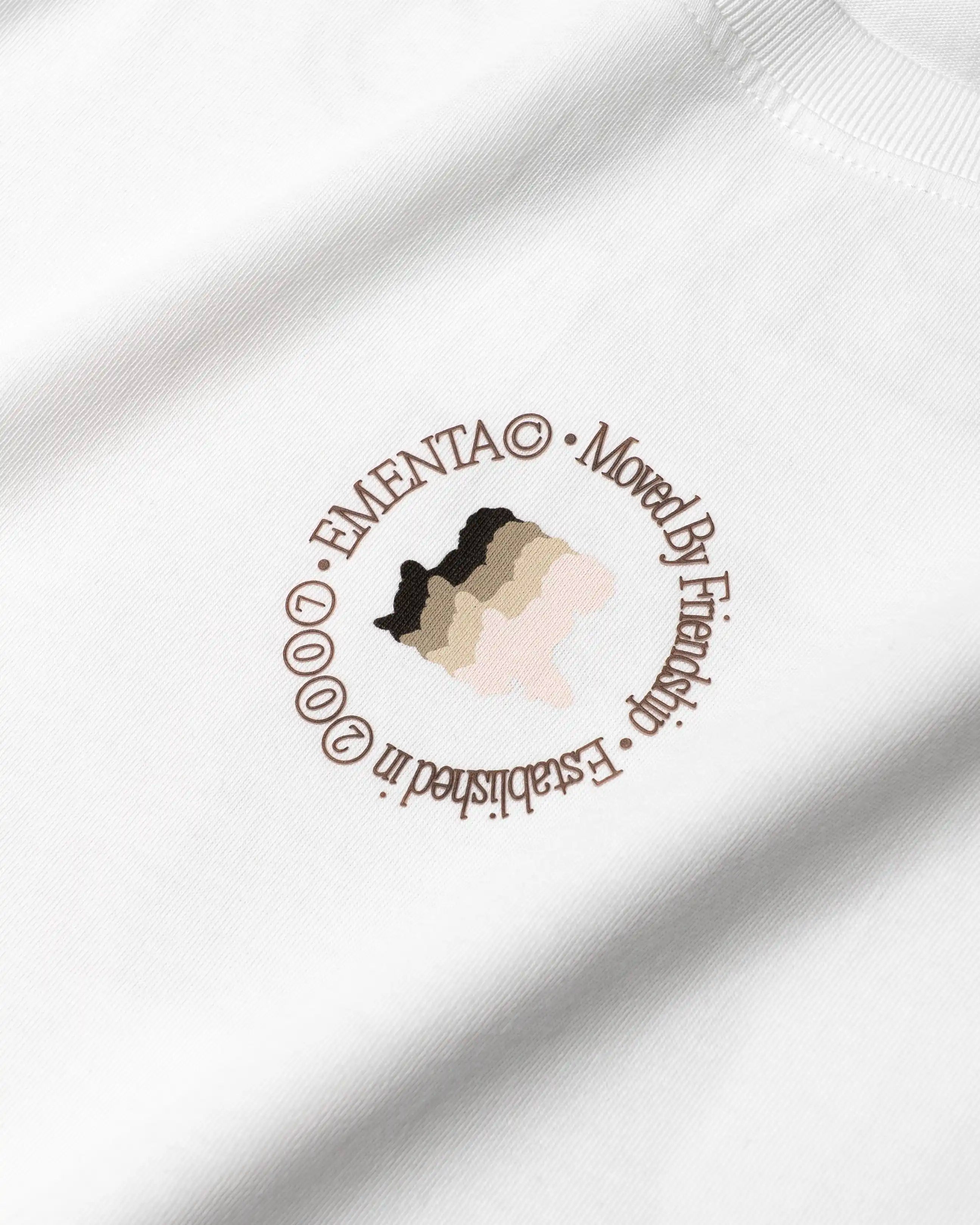 100% Cotton (220gsm)
Heavyweight cotton fabric with soft hand-feel
Boxy, relaxed fit with dropped shoulders
Ribbed crewneck collar
Dragged effect ikon logo on front and back
Artwork celebrates friendship and unity
"EMENTA© Moved By Friendship" motto on front and back
Double-stitched hems for durability
Made in Portugal