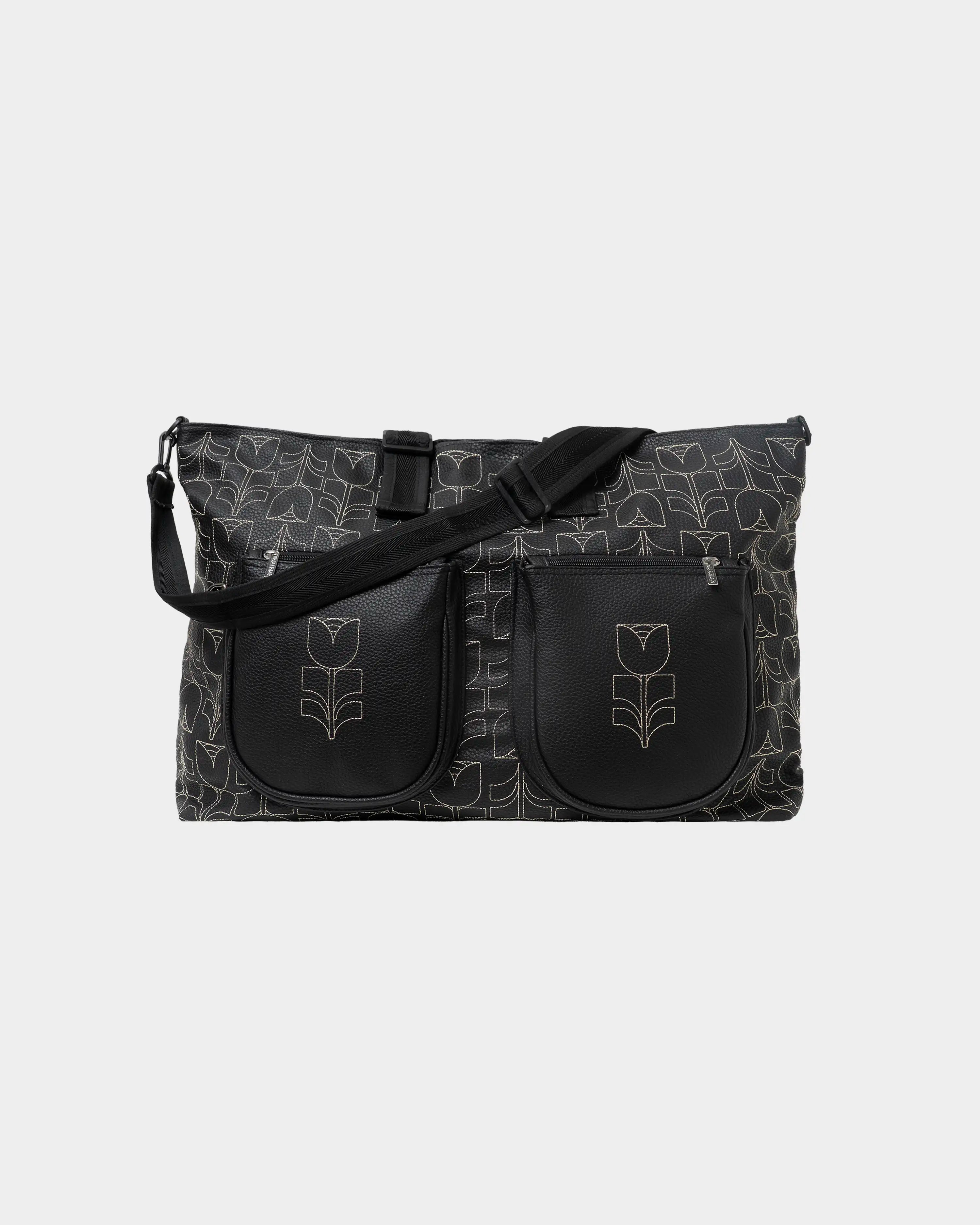 Part of the Flourish Collection
Black synthetic leather exterior with all-over embroidered Flourish pattern
Adjustable shoulder strap
Spacious 40L capacity
Two exterior zip pockets
Rear zip pocket for quick-access essentials
Interior zip pocket for secure storage
Cabin-size dimensions suitable for most airlines
Weekend bag
Dimensions: 62 × 40 cm
Handmade in Portugal