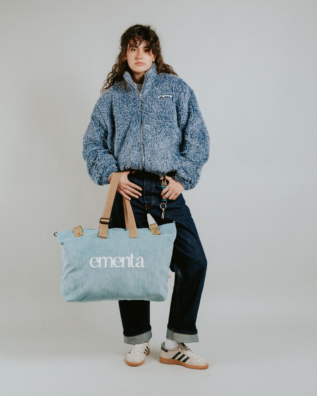 The Poncha Jacket is designed for warmth and comfort with its soft blue fur exterior. Inside, it features diamond stitching for added texture and durability.

It offers elasticated wrists and hips for a customizable fit, two exterior pockets and an interior pocket for convenient storage.