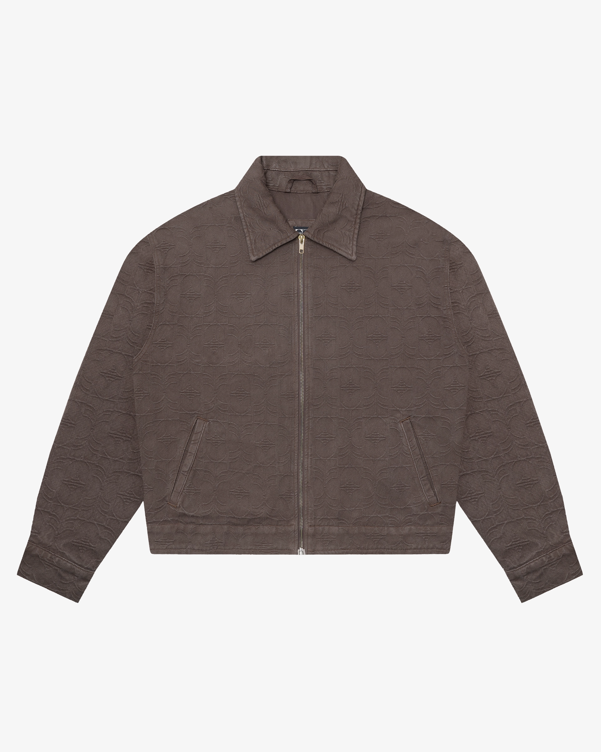 Zip-up jacket from the Flourish collection, suitable for layering across seasons.
Cotton jacquard fabric with a structured feel and an all-over tonal woven Flourish pattern.
Relaxed fit with a straight silhouette for comfortable layering.
Two front welt pockets, full metal zip closure, adjustable hem tabs, and custom metal button details on the cuffs.
Chocolate colourway with a tonal jacquard finish throughout.
Made in Portugal.