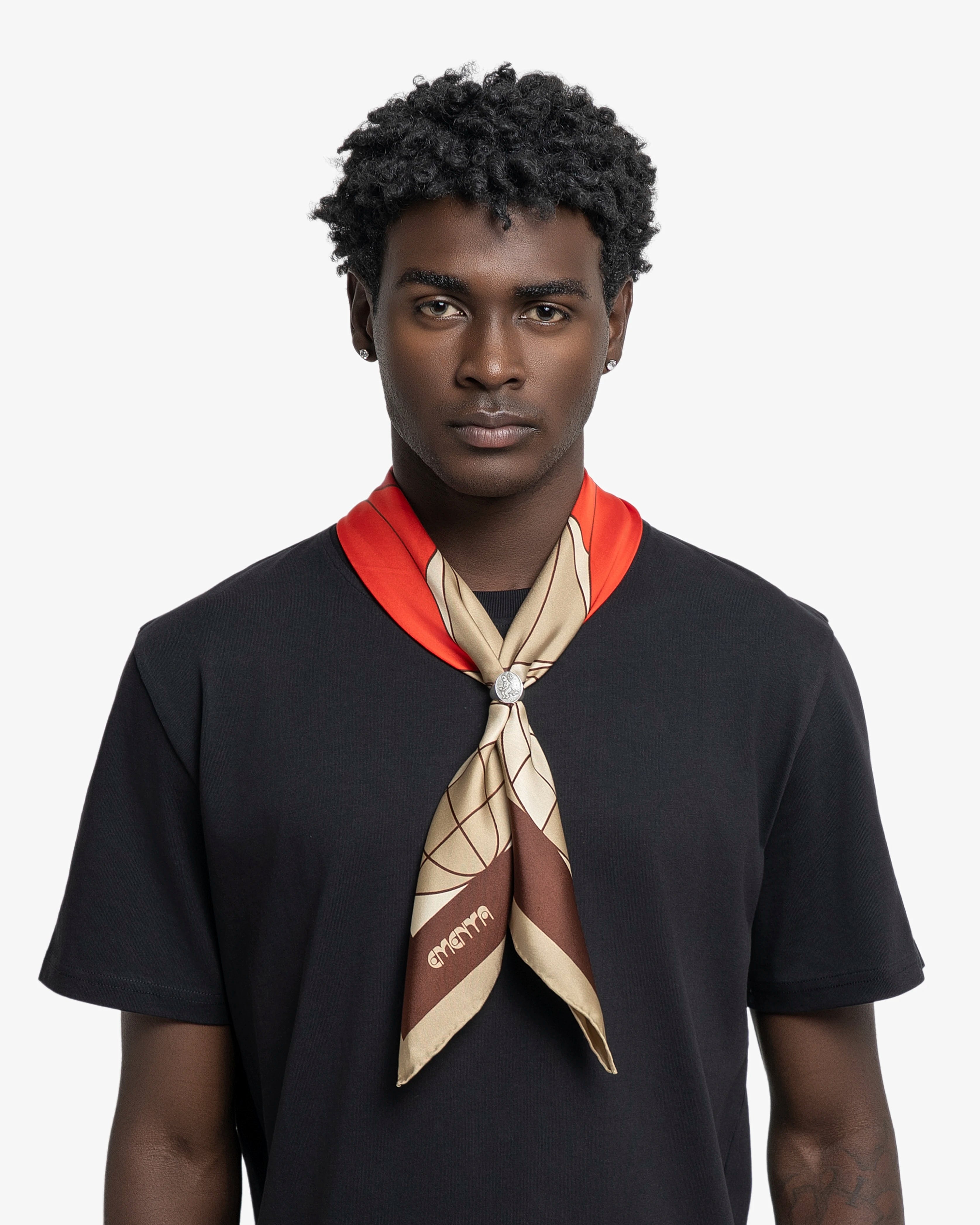 Silk scarf designed as a versatile accessory for styling around the neck, head or bag
Lightweight silk with a smooth, fluid hand feel
90 × 90 cm square shape featuring a geometric floral pattern in red, coral, beige and dark brown
Blossom artwork combines repeated petal forms with globe-inspired graphic elements and fine line detailing
Finished with a dark brown border framing the central pattern