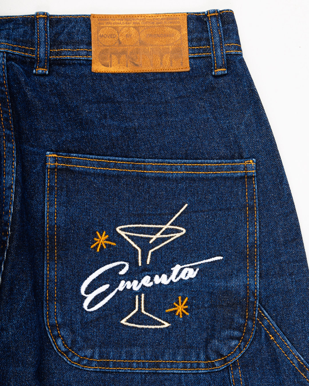 Relaxed-fit jeans made from blue marble stone-washed denim, designed for comfort and durability with a focus on providing the perfect fit. The jeans feature the cocktail design embroidered on the back pocket for added detail. Equipped with two back pockets, two front pockets, and one side pocket for practical storage.