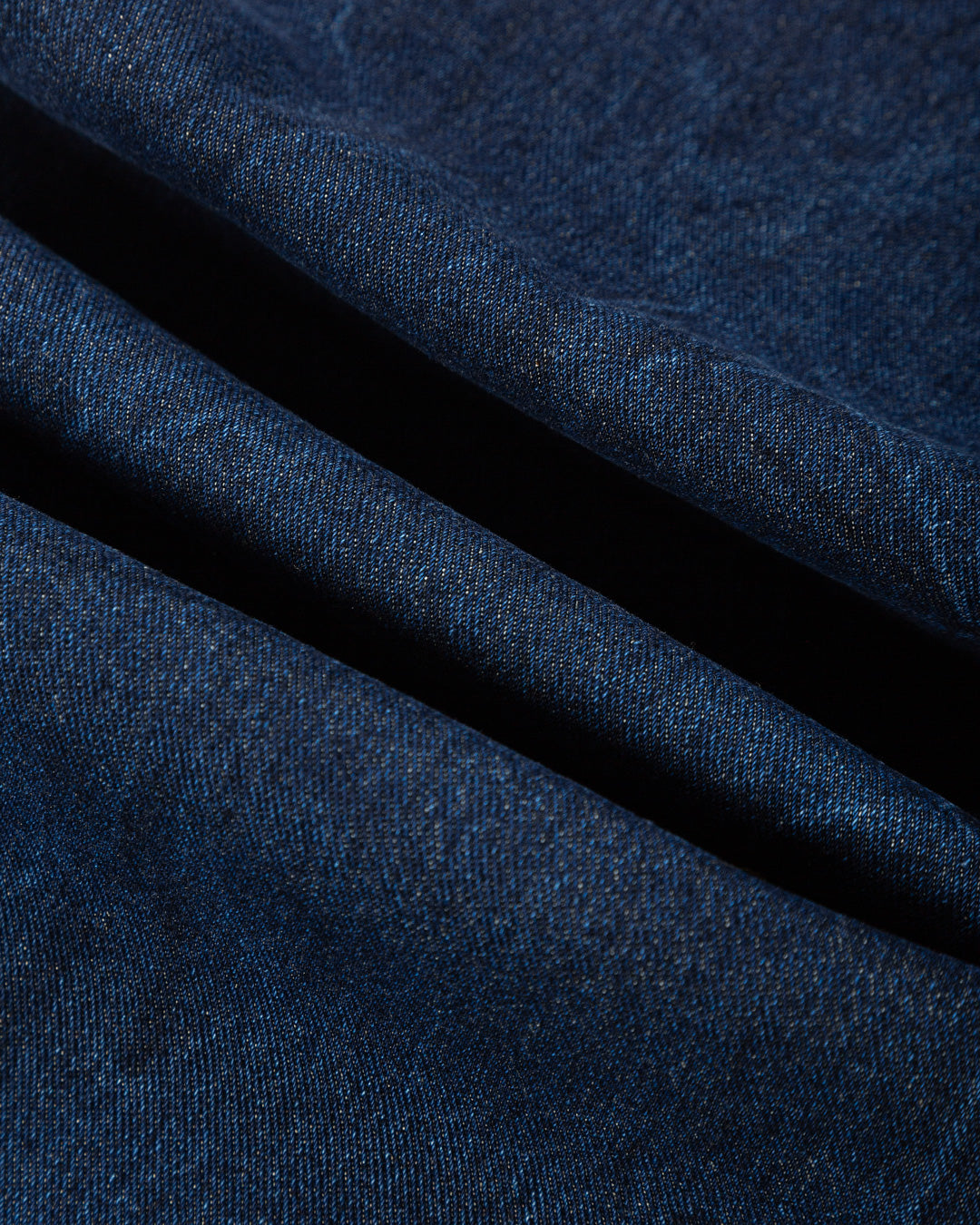 Relaxed-fit jeans made from blue marble stone-washed denim, designed for comfort and durability with a focus on providing the perfect fit. The jeans feature the cocktail design embroidered on the back pocket for added detail. Equipped with two back pockets, two front pockets, and one side pocket for practical storage.