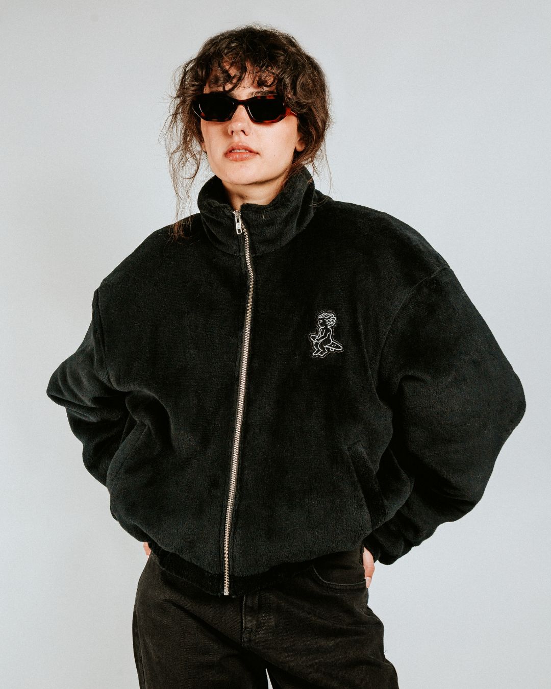 The Ikon Fur Jacket features a soft black fur exterior and diamond stitching on the inside. The jacket also has the Ikon logo embroidered on the back, along with a corduroy interior for added detail.

It includes adjustable elasticated wrists and hips for a more tailored fit, along with two exterior pockets and one interior pocket for storage.