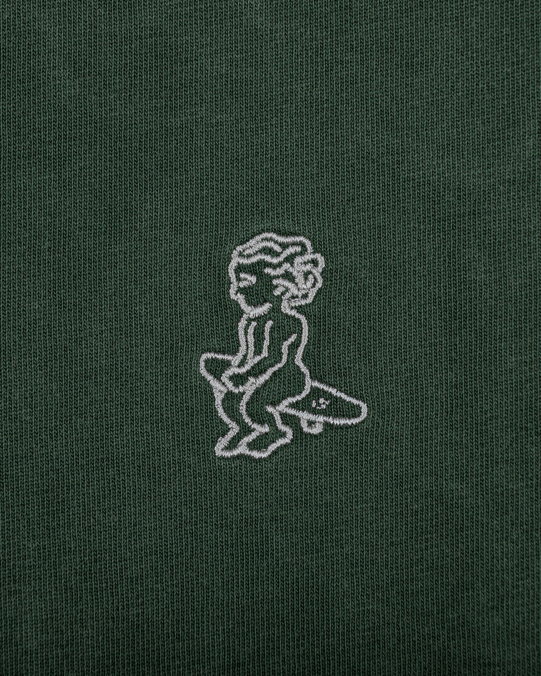 The Ikon Washed T-Shirt has a dark green-washed finish and features the Ikon stamp embroidery on both the front and back, crafted from 100% cotton for lasting comfort and durability.