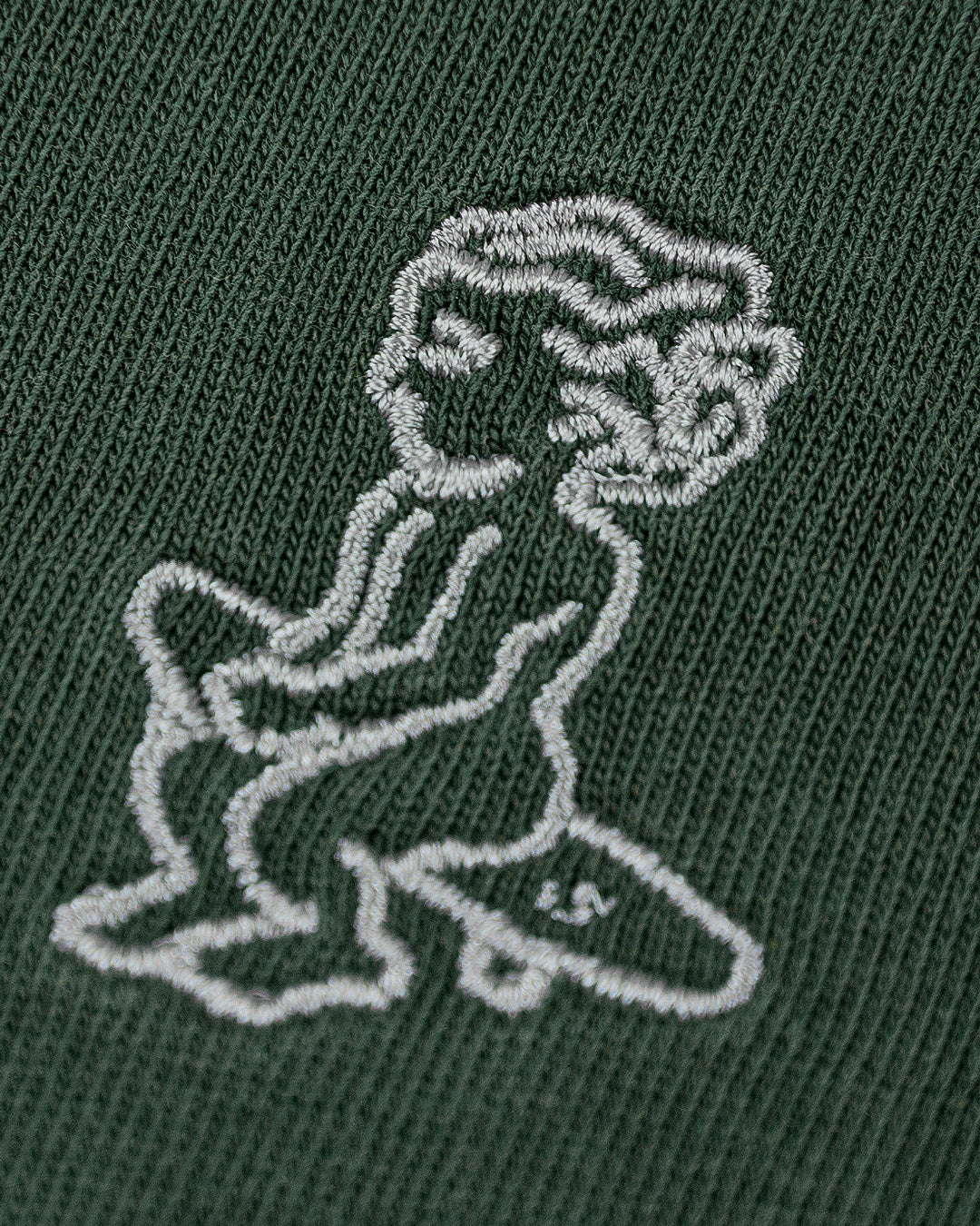 The Ikon Washed T-Shirt has a dark green-washed finish and features the Ikon stamp embroidery on both the front and back, crafted from 100% cotton for lasting comfort and durability.