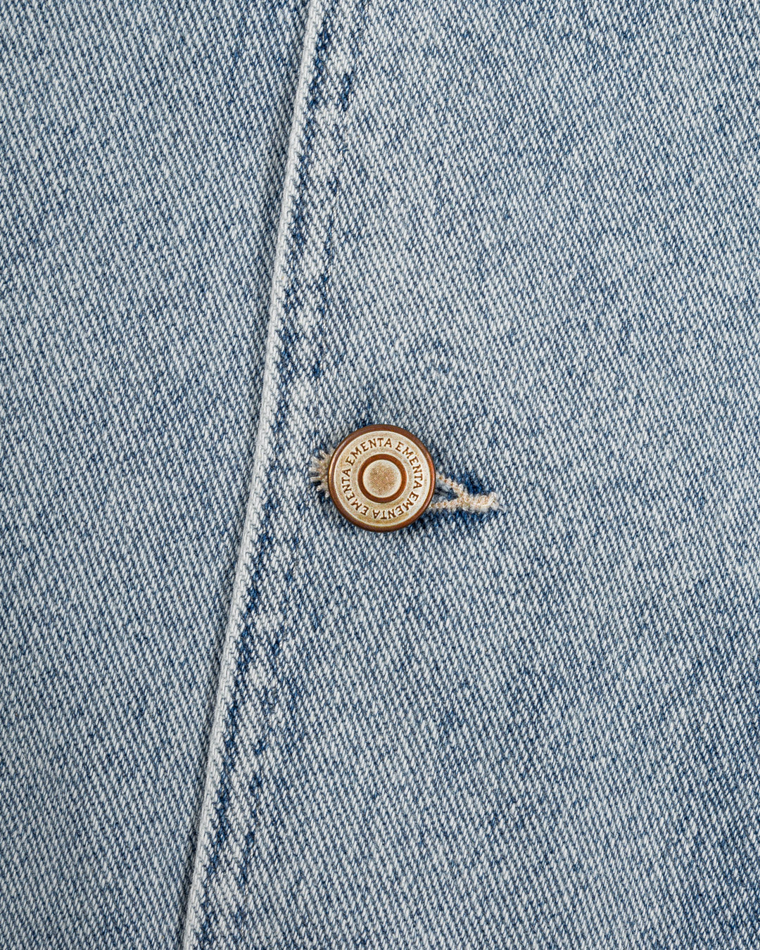 Faded denim vest made from durable cotton, featuring a unique gradient-wash effect. The vest is detailed with an embroidered Ikon logo on the chest.