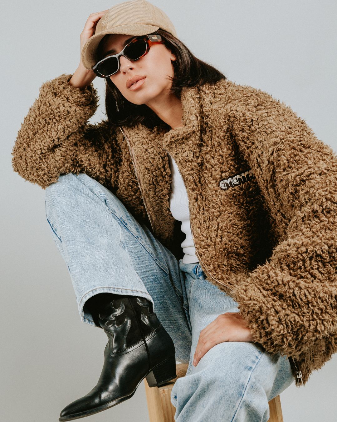 The Poncha Jacket in camel is designed for warmth and comfort with its soft camel fur exterior. Inside, it features diamond stitching for added texture and durability.

It offers elasticated wrists and hips for a customizable fit, two exterior pockets and an interior pocket for convenient storage.