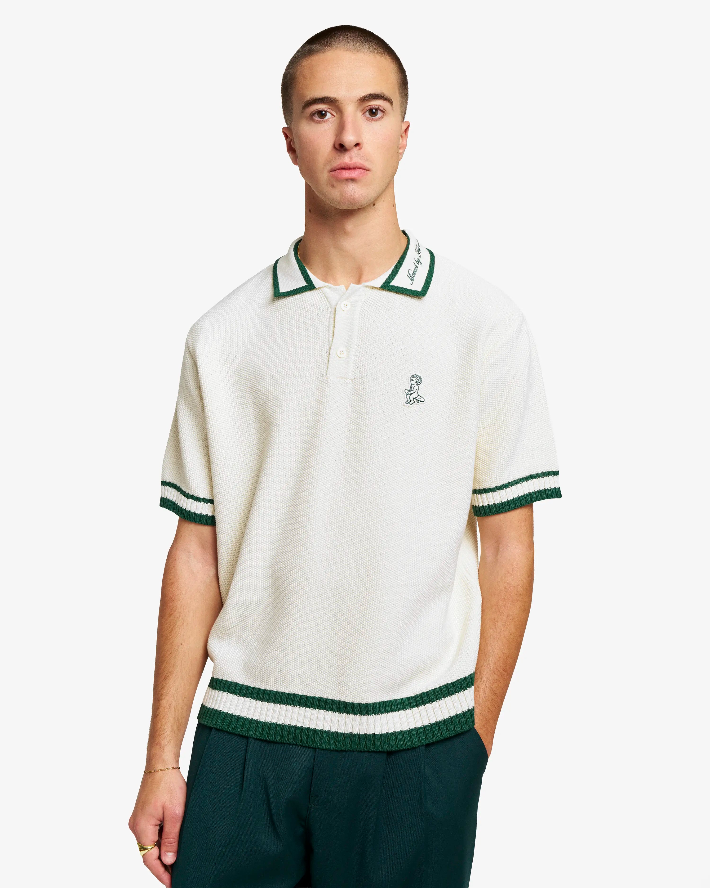 Crafted in Portugal with a textured knit construction
Features the signature Ikon logo patch on the chest
Collar embroidered with the “Moved by Friendship” motto
Contrast evergreen tipping on the collar, cuffs, and hem
Classic three-button placket
Relaxed, easy-wear fit designed for everyday comfort